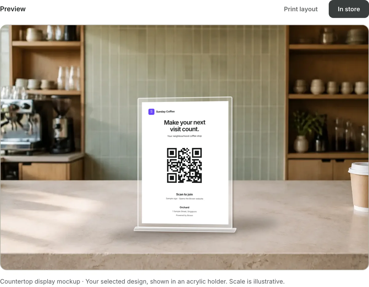 The merchant Branding page’s café-counter preview, showing a portrait A6 join sign in an acrylic holder.
