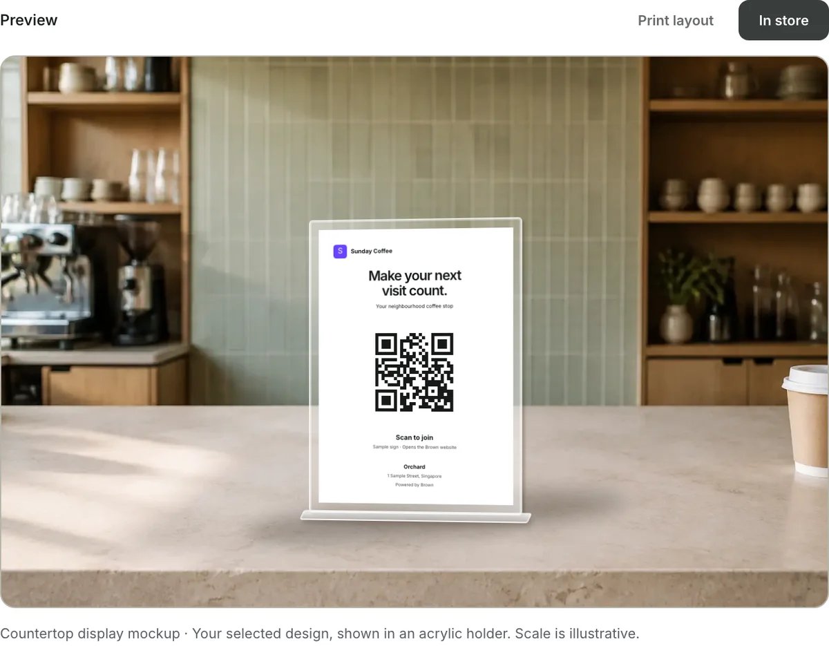 The merchant Branding page’s café-counter preview, showing a portrait A6 join sign in an acrylic holder.