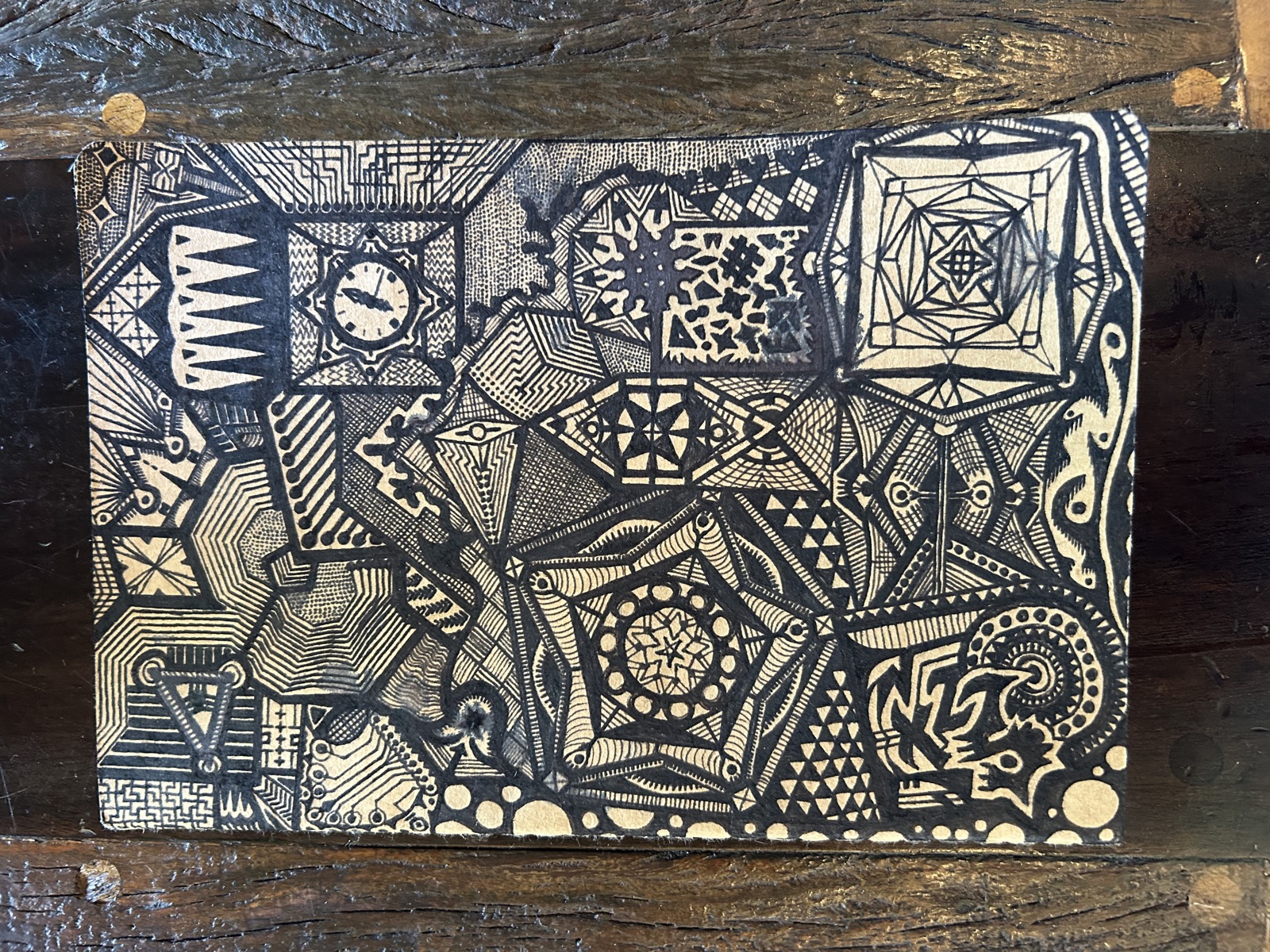 Geometric pen and ink drawing on gold cardstock