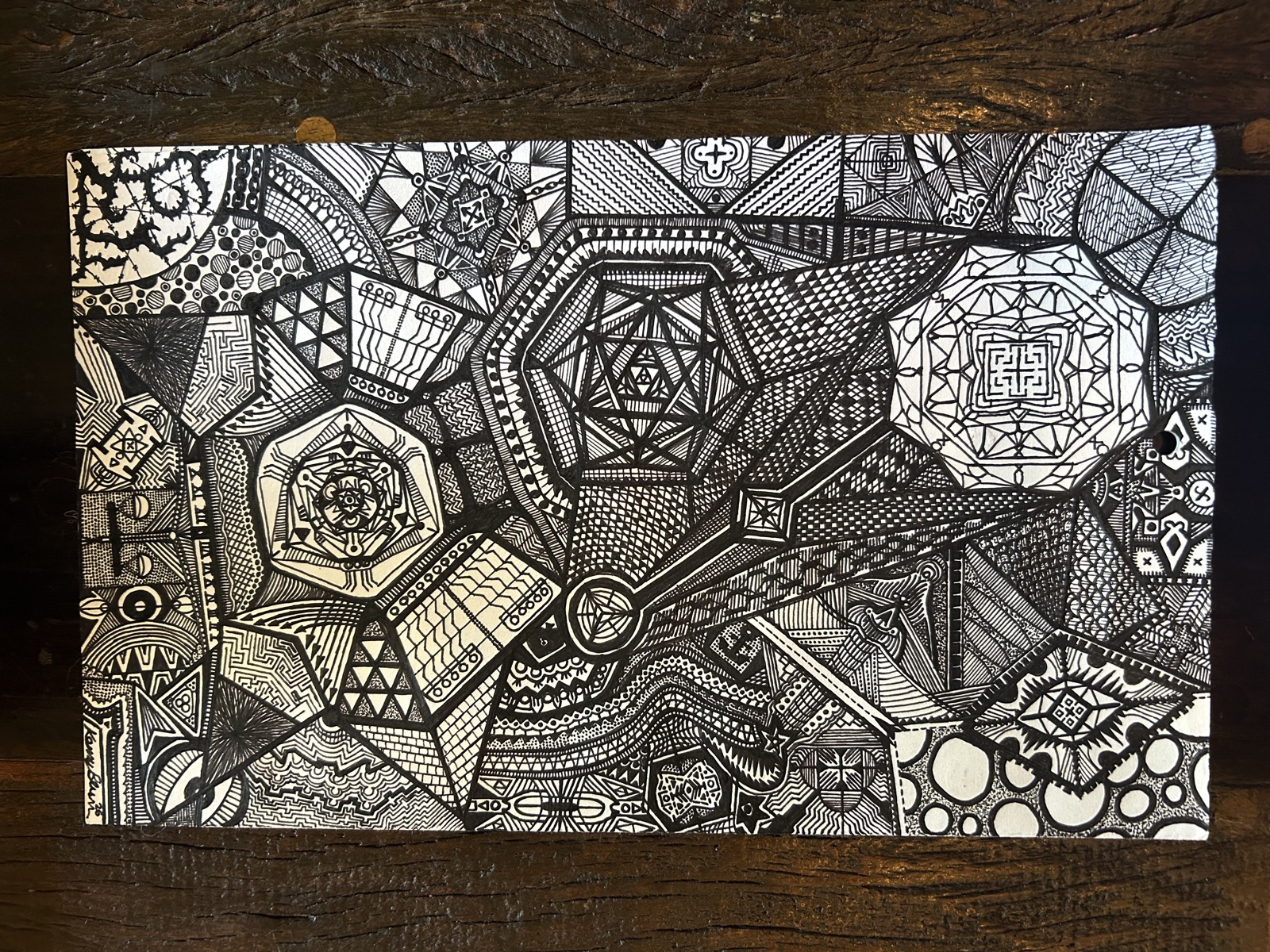 Geometric pen and ink drawing on gold cardstock