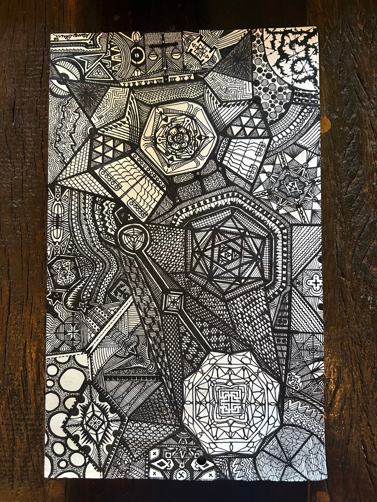 Geometric pen and ink drawing on gold cardstock