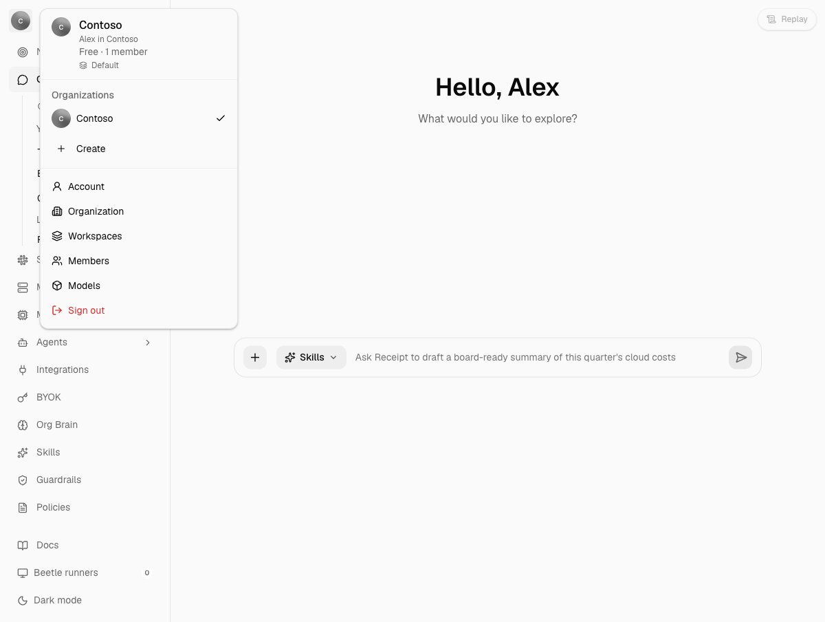 The organization menu open over the chat screen, showing the organization name, an Alex in Contoso line, a Free and 1 member summary, a Default workspace row, the Organizations list with a Create entry, and links to Account, Organization, Workspaces, Members and Models above Sign out.