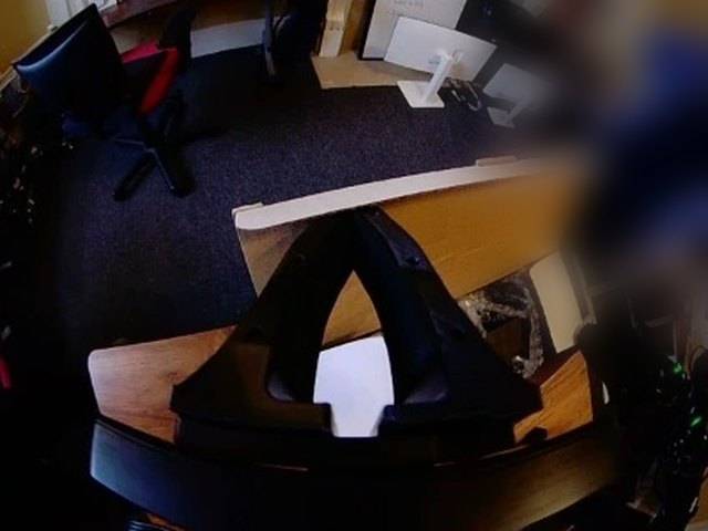 A photo from the left wrist camera on site, at night under warm lamps