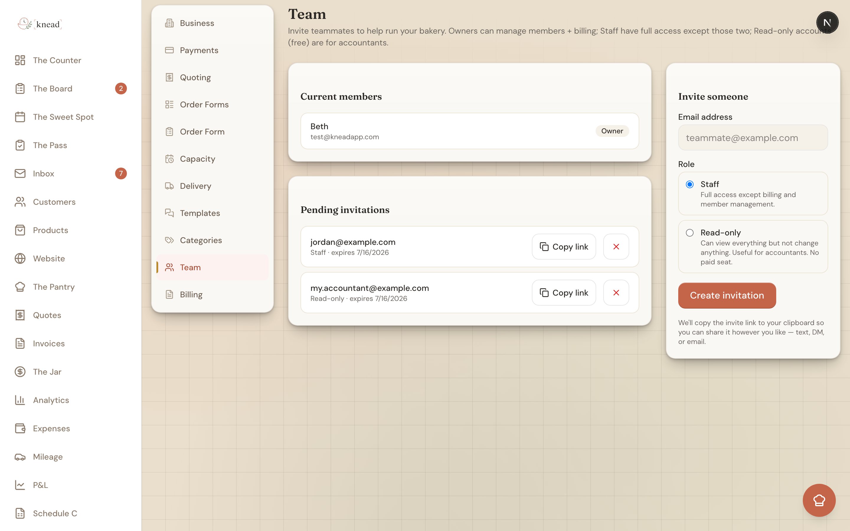 The Members settings page listing team members with their roles and an invite option
