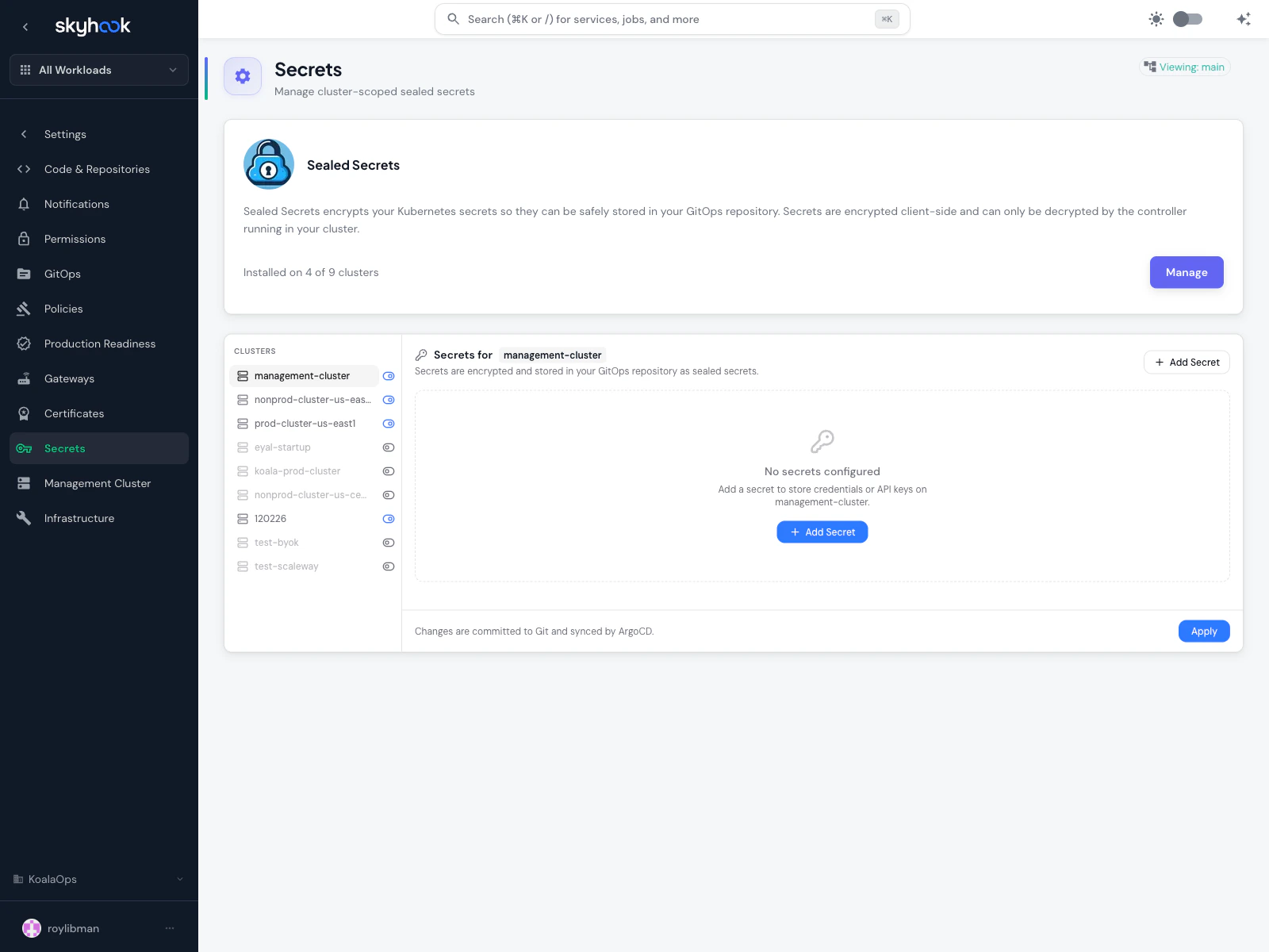 Secrets settings page showing a Sealed Secrets installation banner (installed on 4 of 9 clusters), a cluster picker sidebar, and an empty-state for the selected management-cluster with an Add Secret button