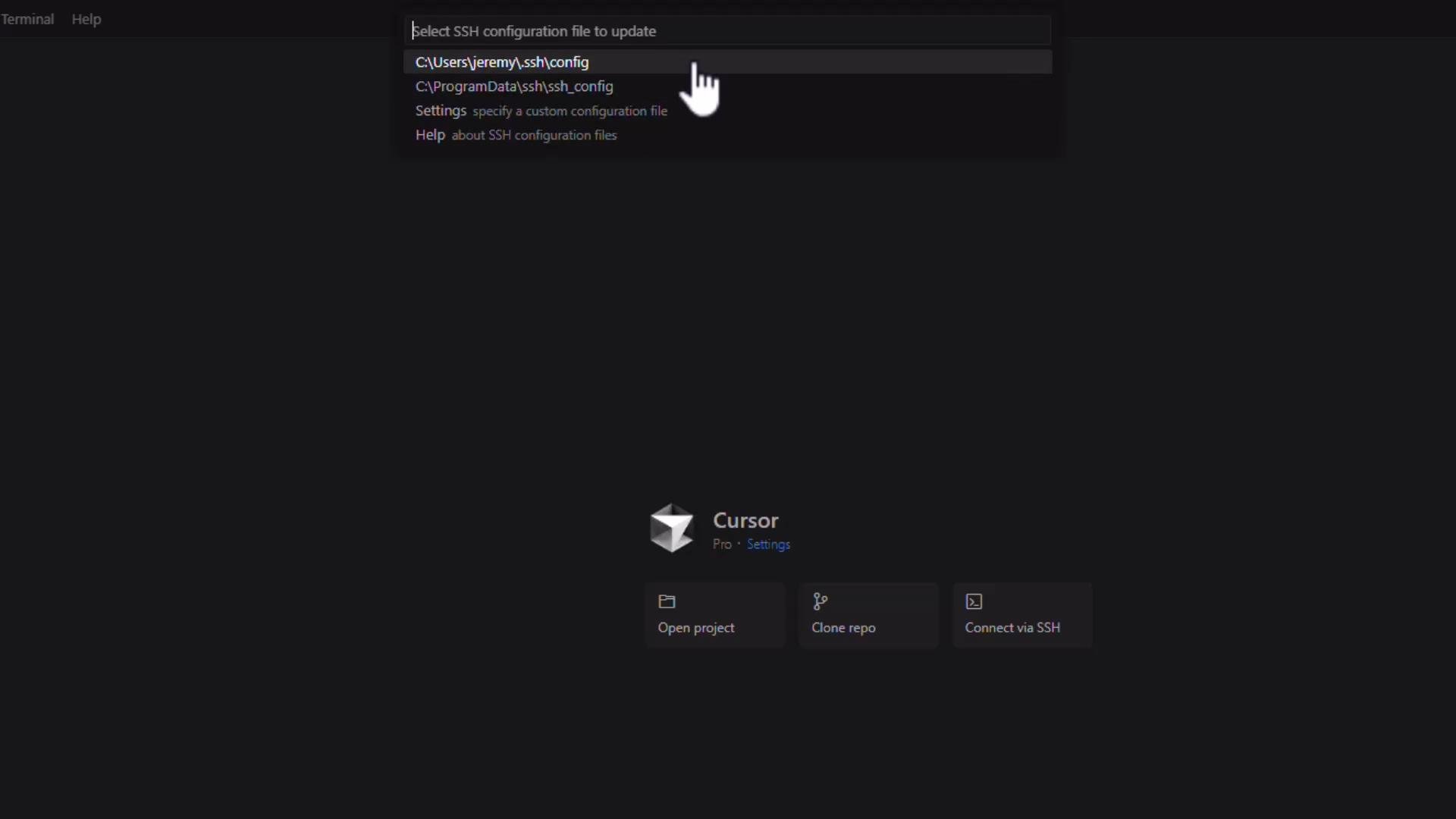 A dark-themed app window showing a prompt to select an SSH configuration file (highlighting a local .ssh/config path). The main area displays a "Cursor" welcome screen with buttons for Open project, Clone repo, and Connect via SSH.