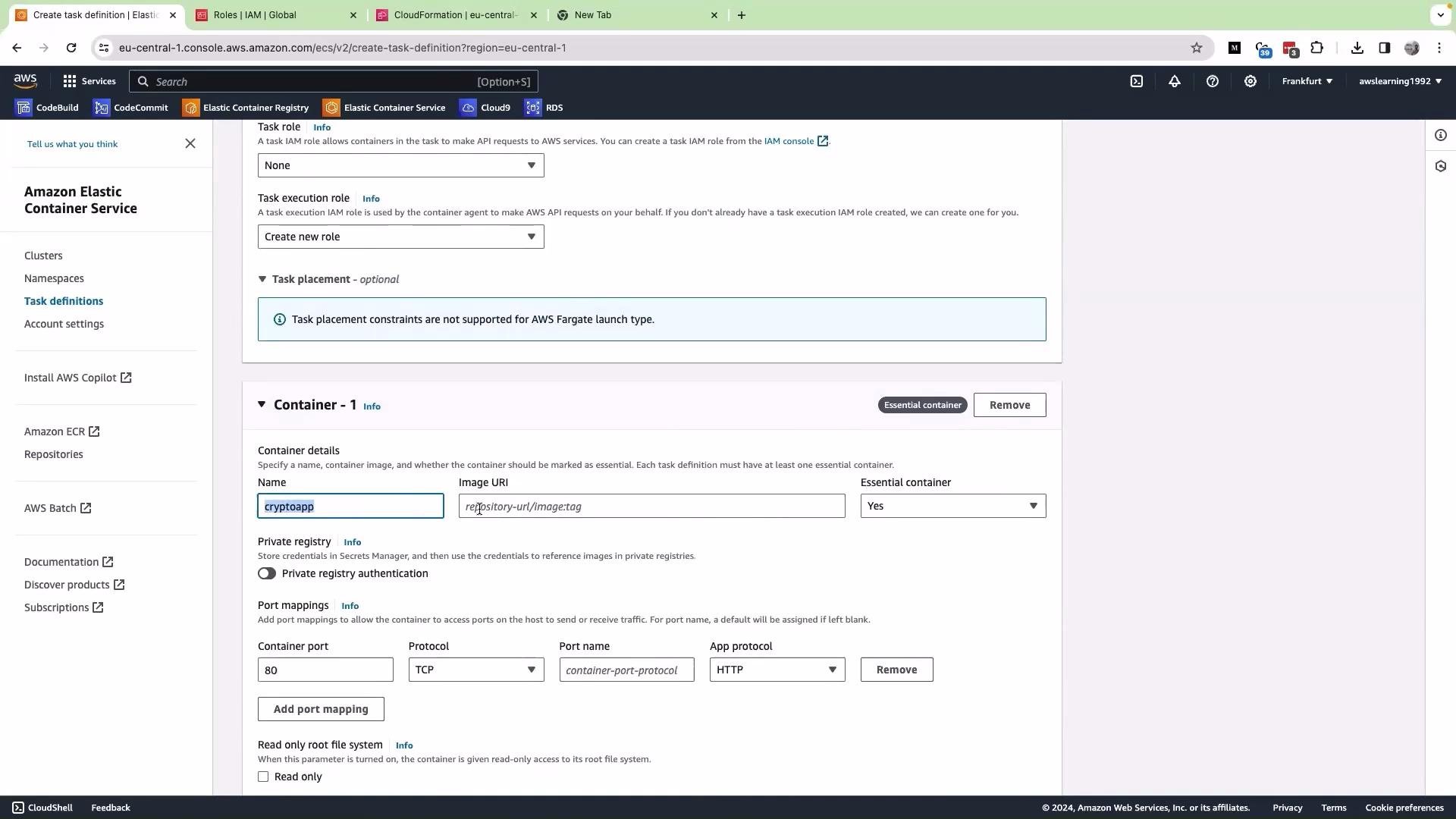 The image shows a screenshot of the Amazon Elastic Container Service (ECS) console where a task definition is being created, with settings for a container named "cryptoapp".