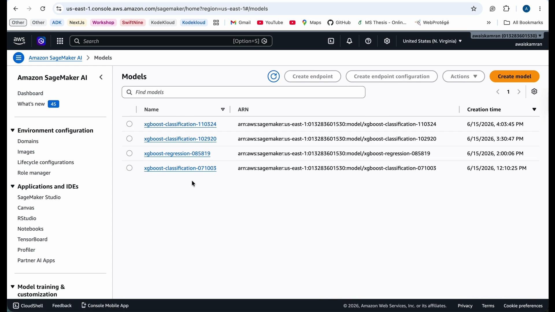 The image shows the Amazon SageMaker console with a list of machine learning models, including xgboost-classification and xgboost-regression, along with their creation times.