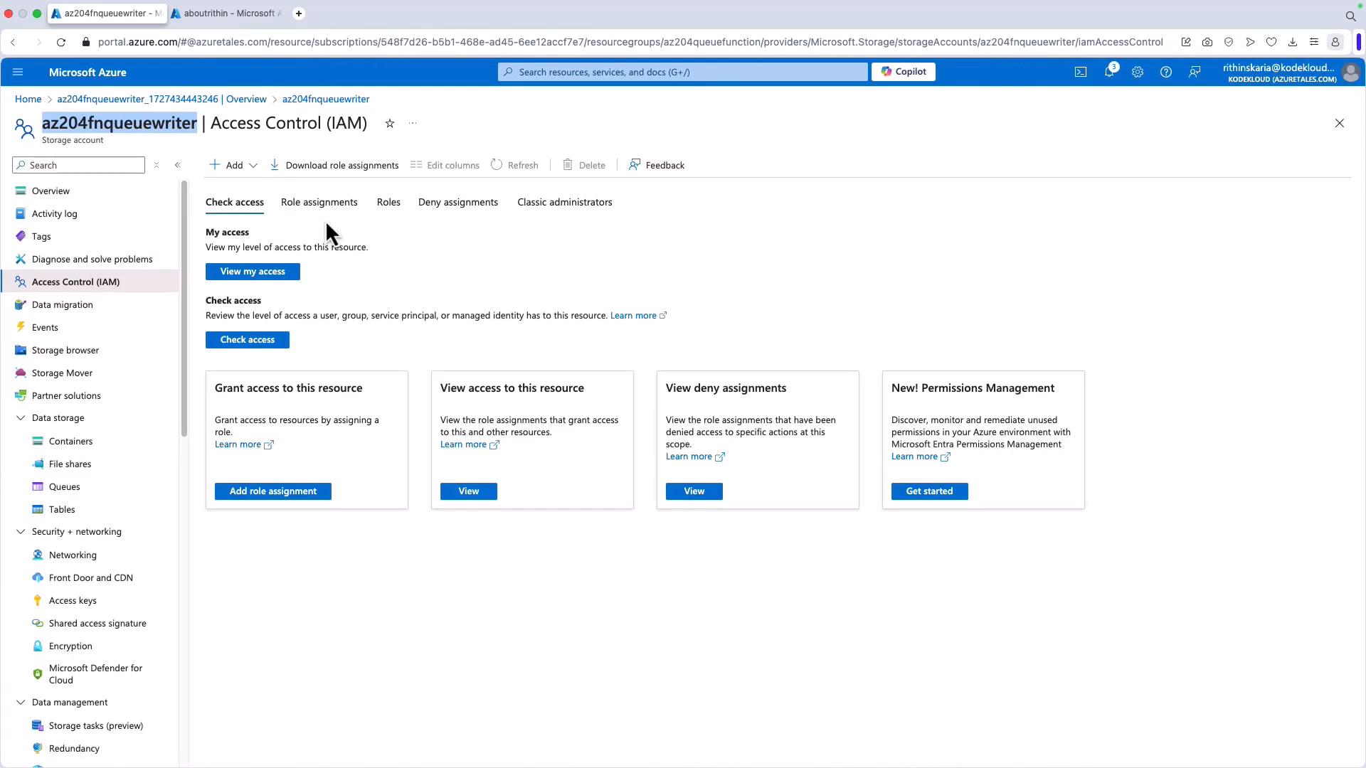A screenshot of the Microsoft Azure portal showing the Access Control (IAM) page for a storage account named "az204fnqueuewriter." The page displays options to view/check access, add role assignments, and panels for viewing role and deny assignments.