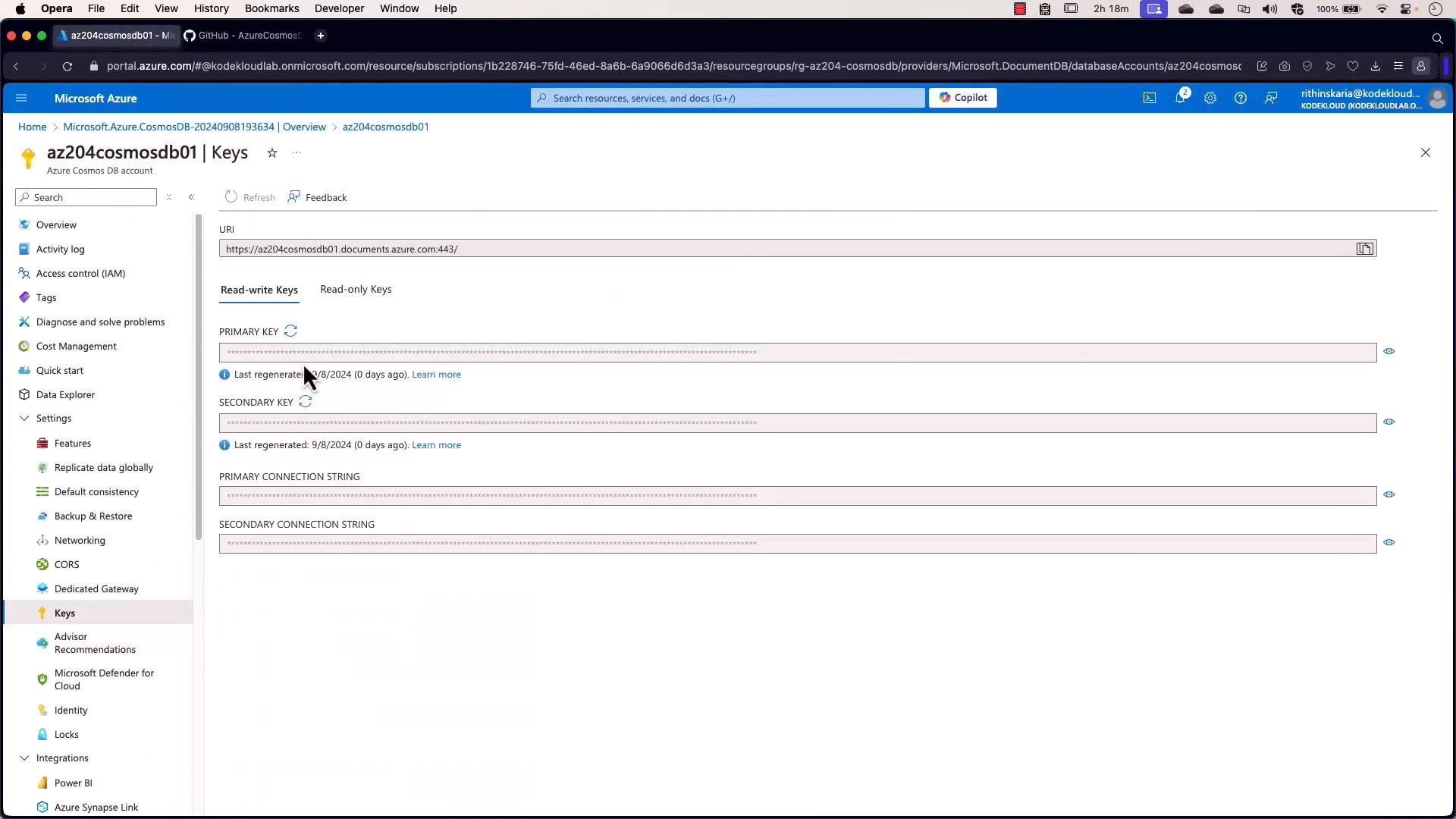 A screenshot of the Microsoft Azure portal showing the Keys page for an Azure Cosmos DB account named "az204cosmosdb01," with the account URI, primary/secondary keys, and connection strings displayed (keys masked). The portal's left navigation and account settings are visible.