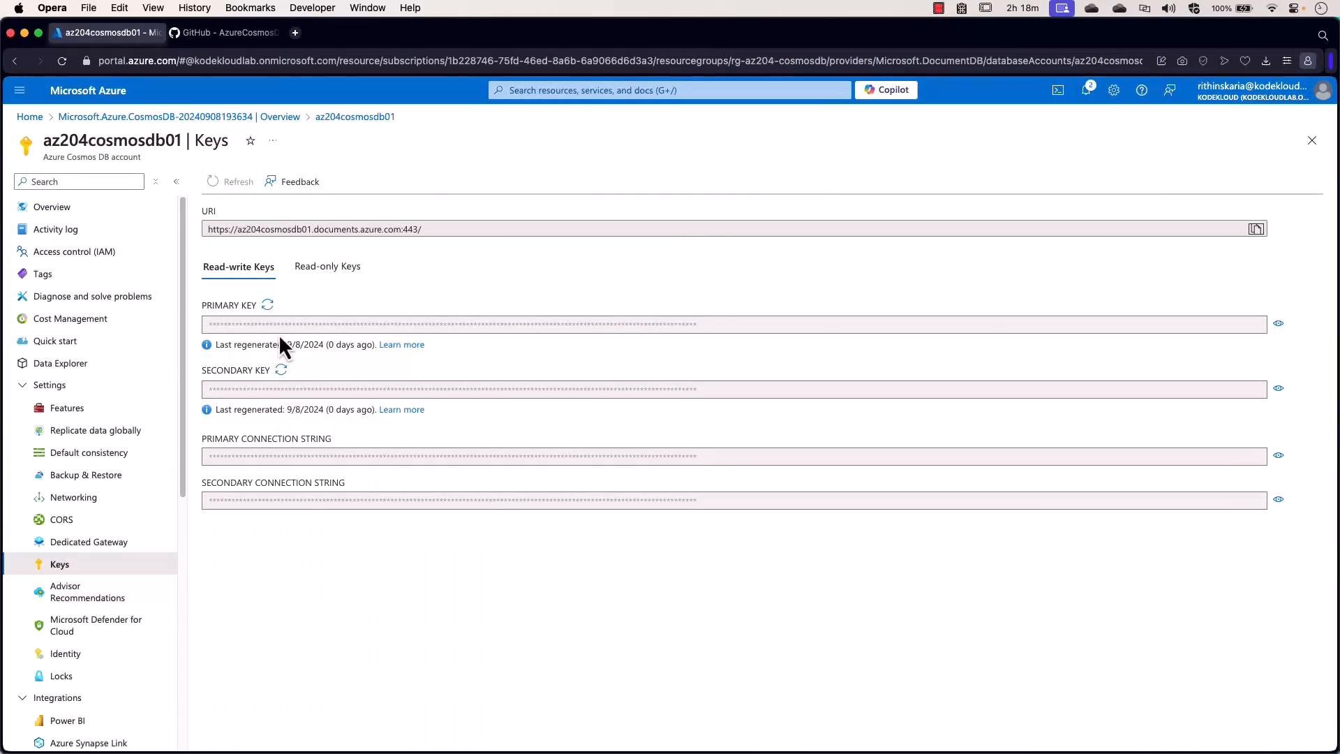A screenshot of the Microsoft Azure portal showing the Keys page for an Azure Cosmos DB account named "az204cosmosdb01," with the account URI, primary/secondary keys, and connection strings displayed (keys masked). The portal's left navigation and account settings are visible.