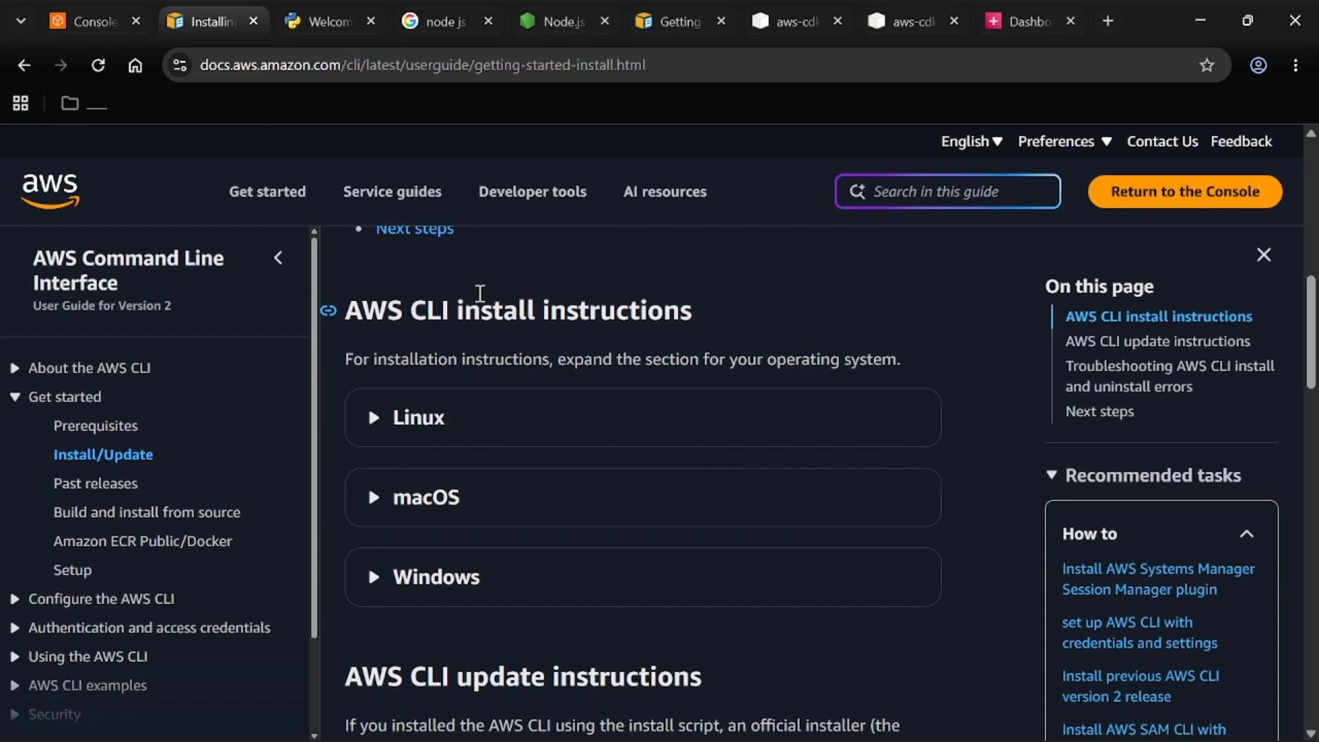 A dark-themed browser screenshot of the AWS documentation page titled "AWS CLI install instructions," showing a left navigation menu and expandable sections for Linux, macOS, and Windows. The top bar shows browser tabs and a "Return to the Console" button.