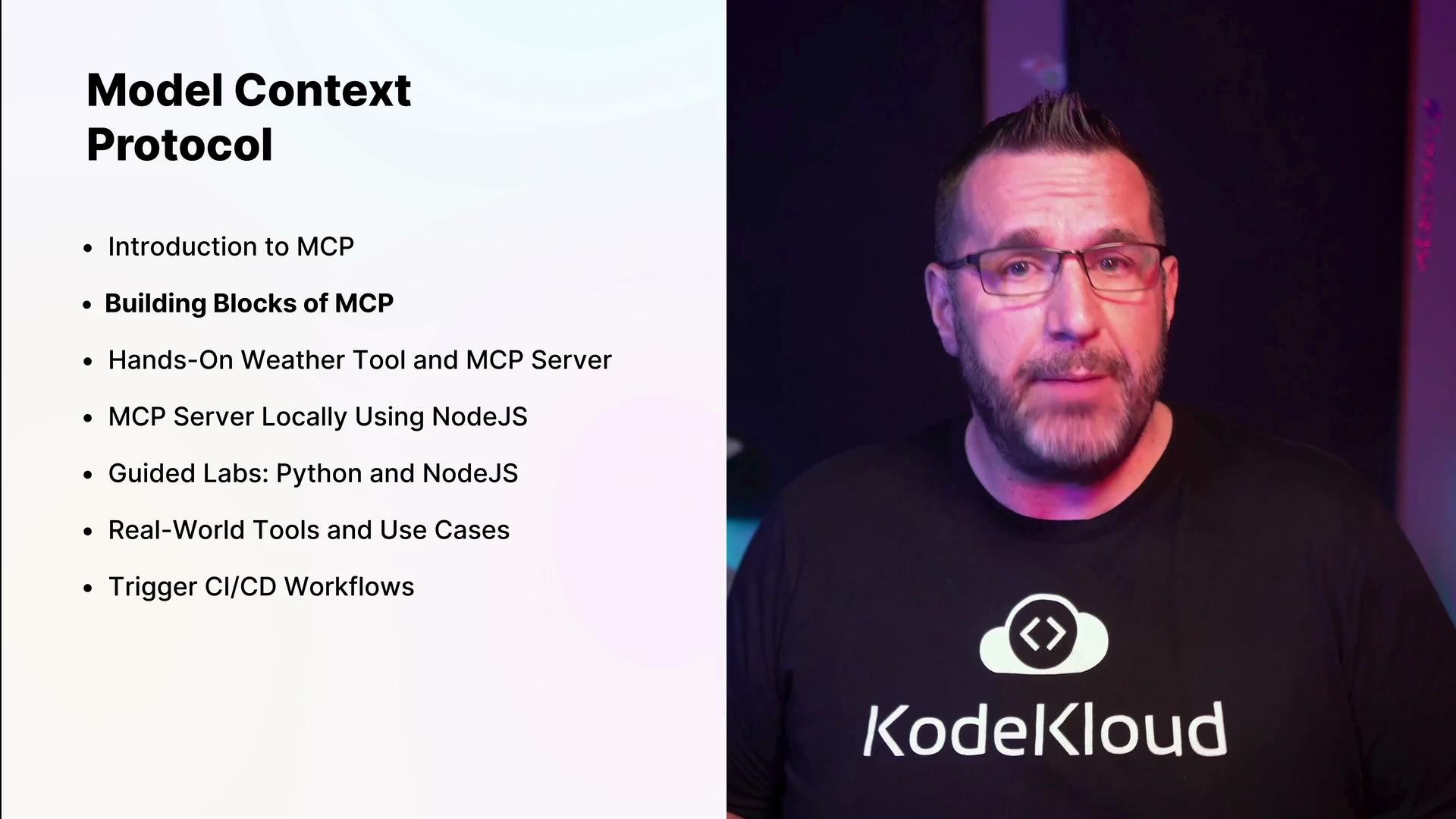 A presenter wearing glasses and a KodeKloud t-shirt stands beside a slide. The slide is titled "Model Context Protocol" and lists bullet-point topics such as "Building Blocks of MCP" and hands-on labs.