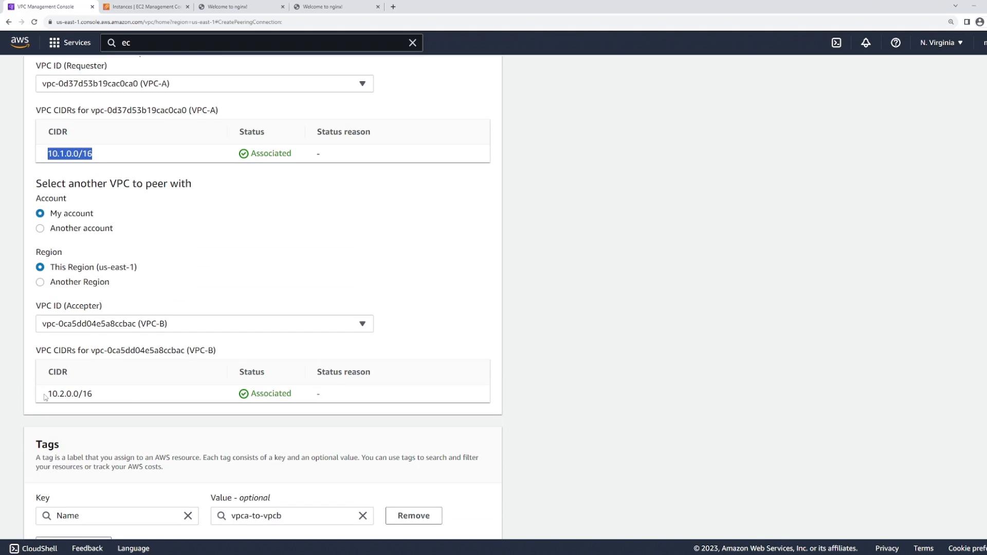 Screenshot of the AWS VPC Management Console on the "Create Peering Connection" page, showing two VPCs being peered (VPC-A 10.1.0.0/16 and VPC-B 10.2.0.0/16) in the us-east-1 region with their CIDRs marked "Associated."