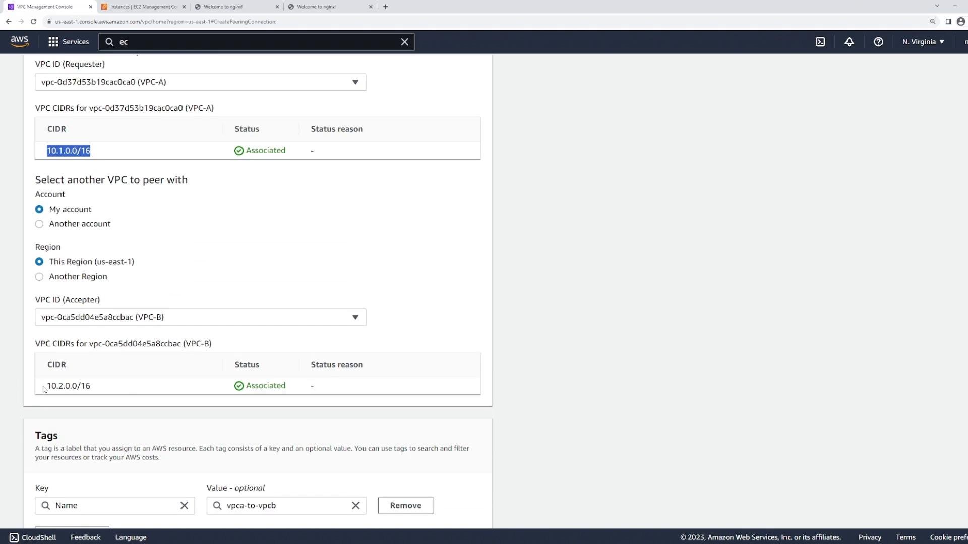 Screenshot of the AWS VPC Management Console on the "Create Peering Connection" page, showing two VPCs being peered (VPC-A 10.1.0.0/16 and VPC-B 10.2.0.0/16) in the us-east-1 region with their CIDRs marked "Associated."