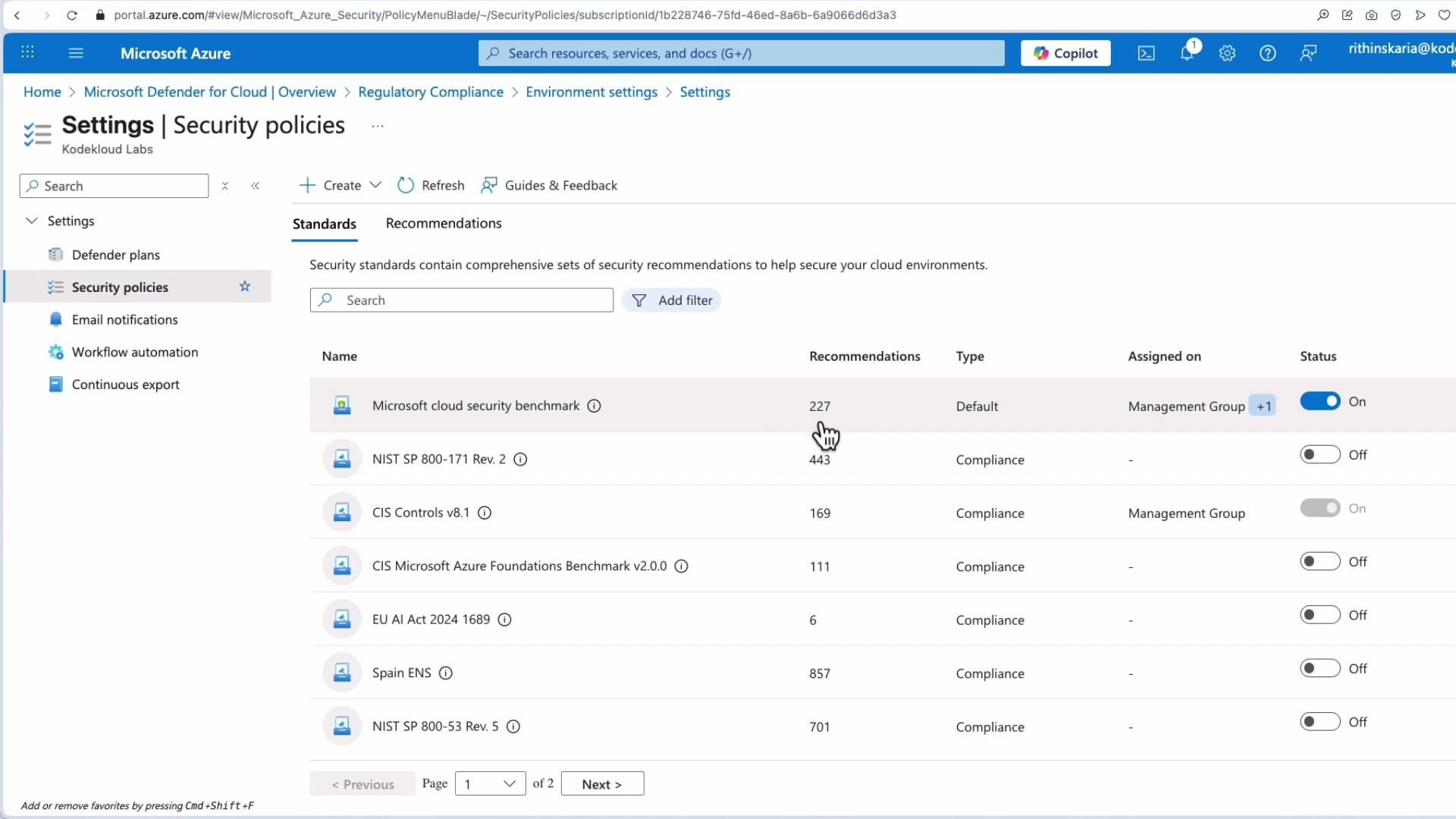 A screenshot of the Microsoft Azure portal open to Settings > Security policies in Microsoft Defender for Cloud, showing a list of security standards (e.g., Microsoft cloud security benchmark, NIST, CIS) with recommendation counts, assignment info, and on/off status toggles. The left menu and top navigation bar are also visible.