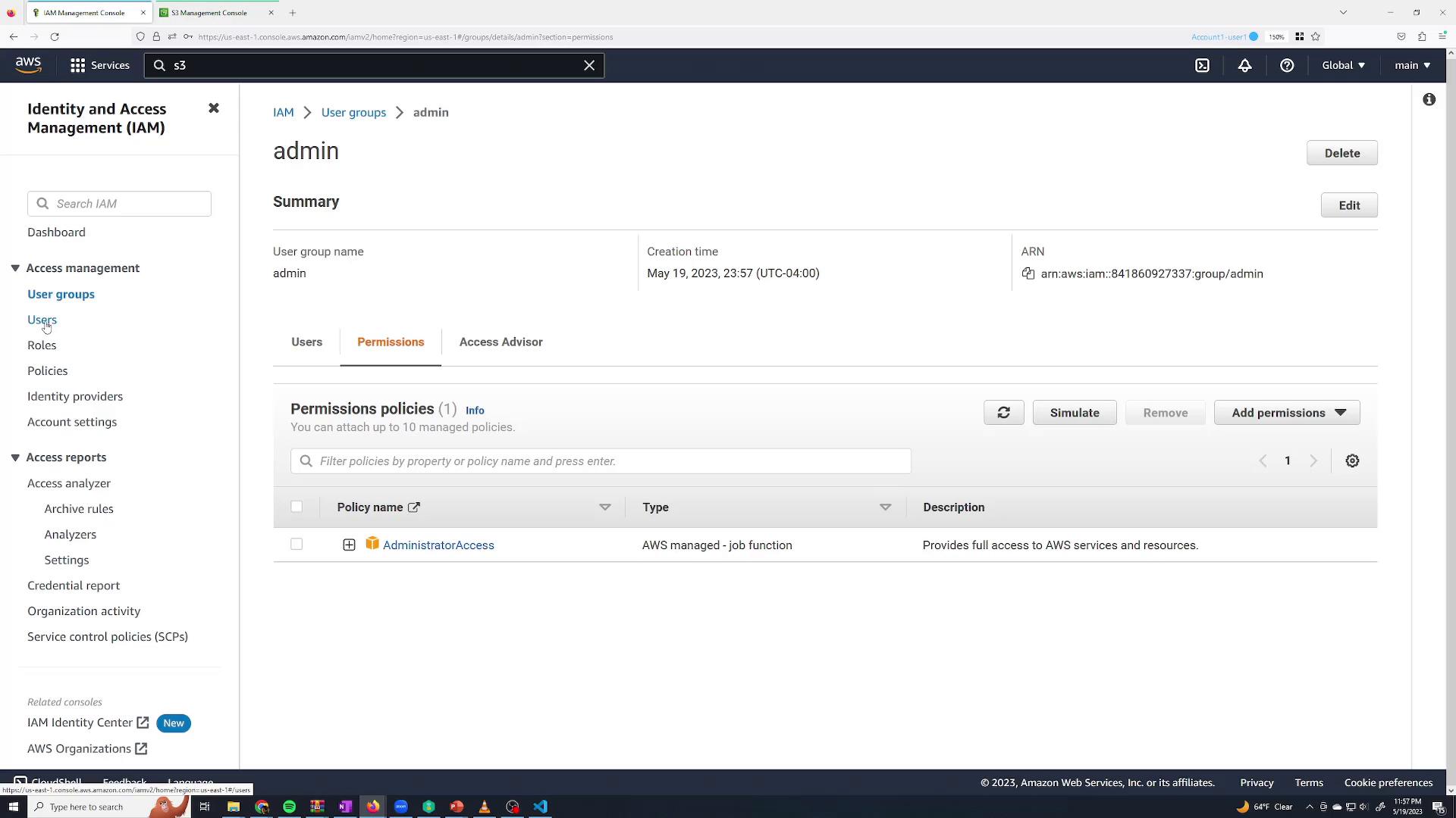 A screenshot of the AWS Identity and Access Management (IAM) console showing the "admin" user group summary with the Permissions tab open. The AdministratorAccess policy is attached and the group's creation time and ARN are visible, with buttons to edit, delete, or add permissions.