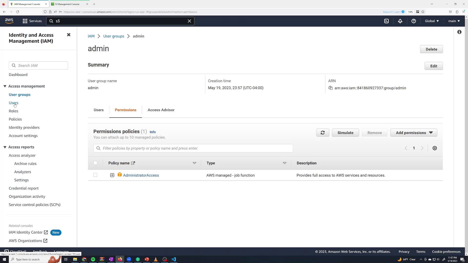 A screenshot of the AWS Identity and Access Management (IAM) console showing the "admin" user group summary with the Permissions tab open. The AdministratorAccess policy is attached and the group's creation time and ARN are visible, with buttons to edit, delete, or add permissions.