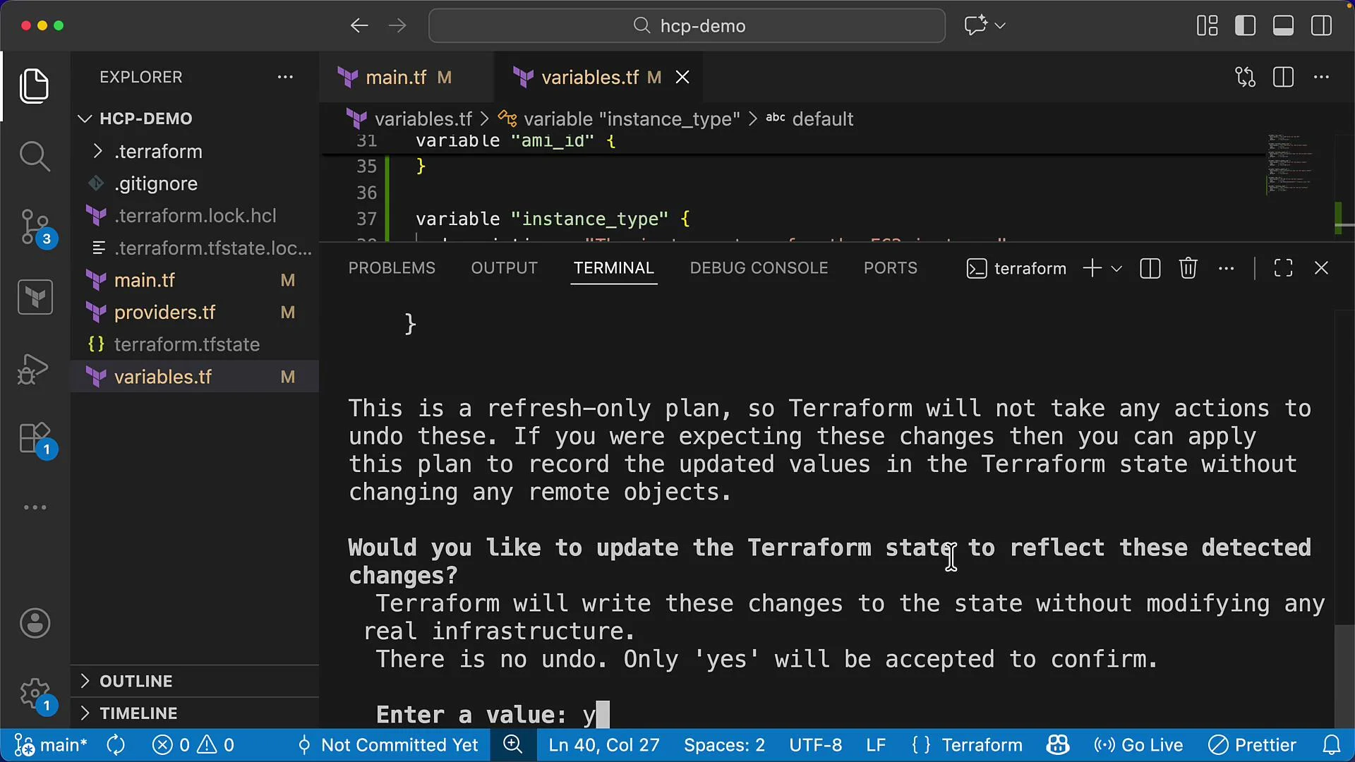 The image displays a code editor window with a Terraform project, showing a terminal prompt asking to update the Terraform state to reflect detected changes.