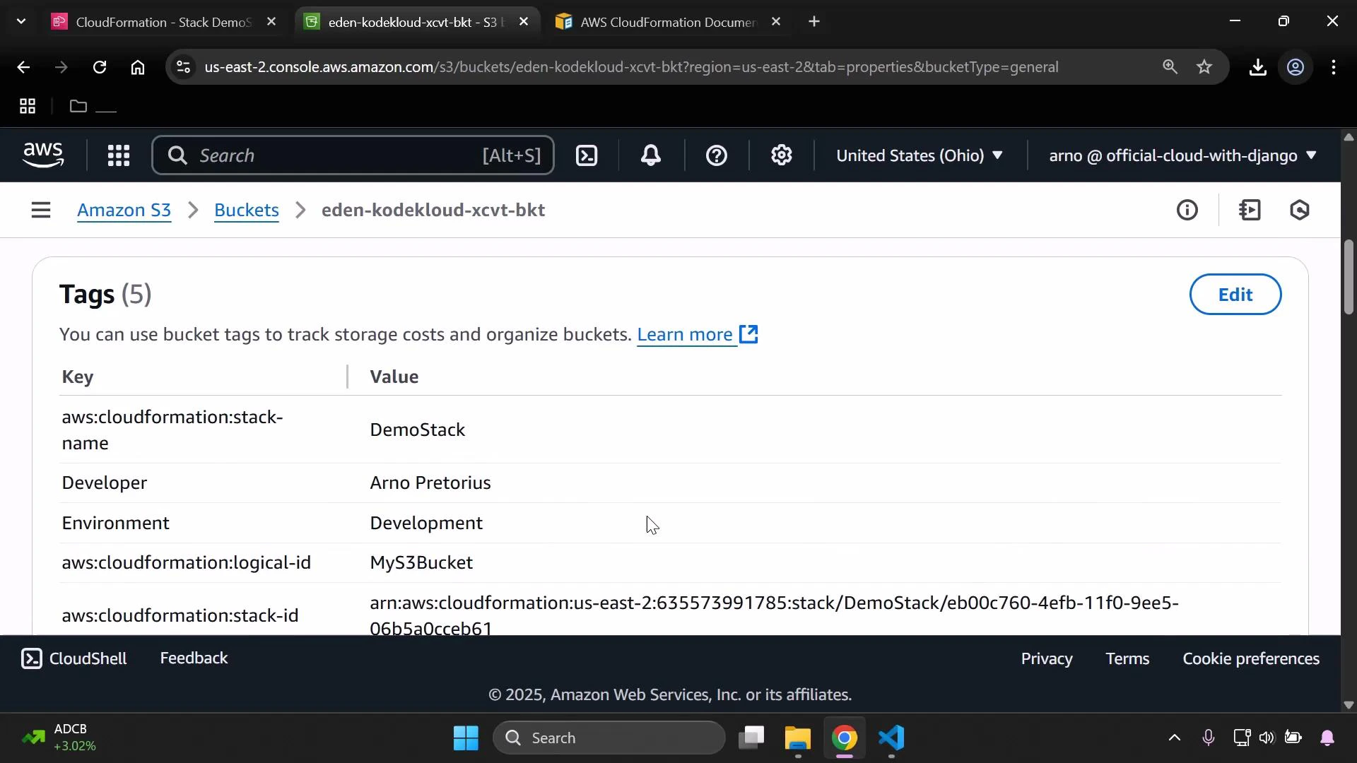 A screenshot of the AWS S3 console showing the Tags panel for the bucket "eden-kodekloud-xcvt-bkt", listing tag keys and values such as aws:cloudformation:stack-name = DemoStack and Environment = Development. The page shows an Edit button and the CloudShell/footer bar at the bottom.