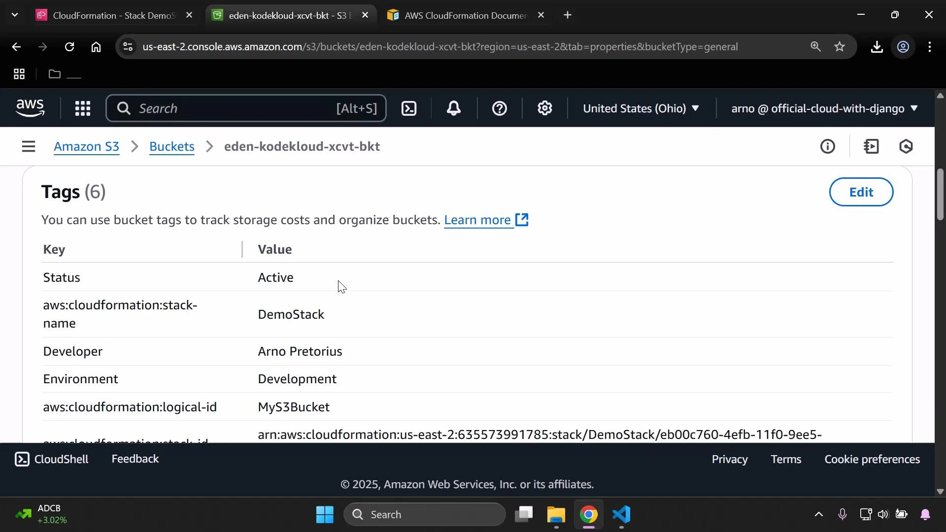 A screenshot of the AWS S3 console showing the Tags page for the bucket "eden-kodekloud-xcvt-bkt", listing tag keys and values like Status: Active, aws:cloudformation:stack-name: DemoStack, Environment: Development, and aws:cloudformation:logical-id: MyS3Bucket. One of the tags shows a developer name (displayed in the image).