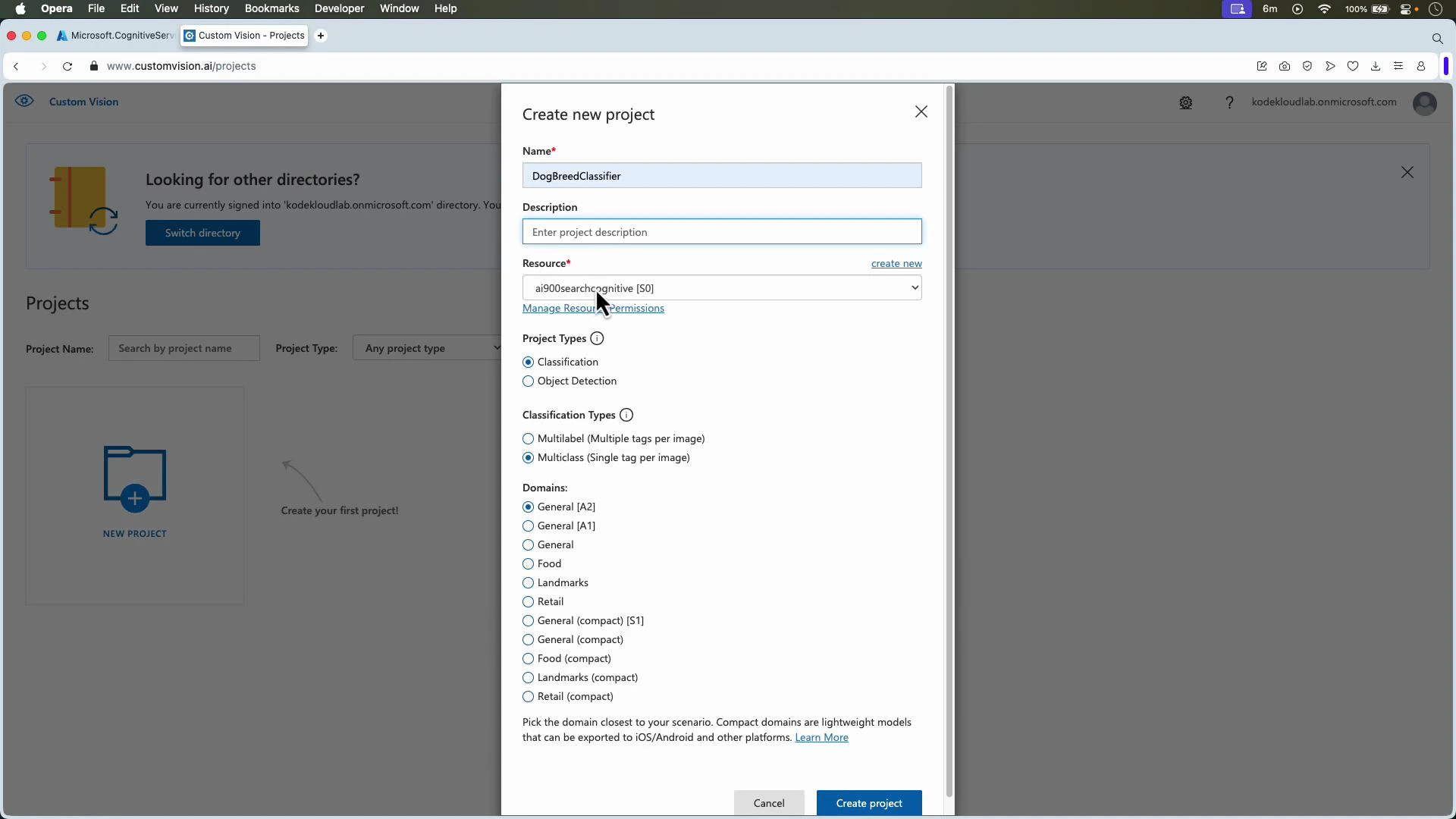 A browser screenshot of the Microsoft Custom Vision web app showing a "Create new project" dialog with the project name set to "DogBreedClassifier" and options for resource, project type, classification type, and domain. The Custom Vision Projects page is visible in the faded background.
