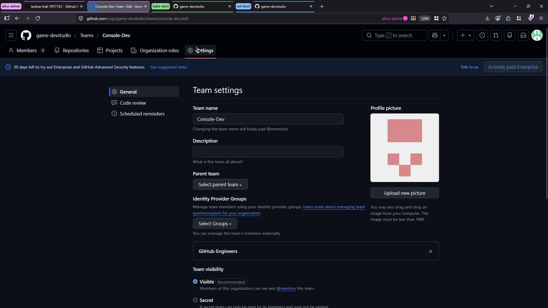 A dark-themed GitHub "Team settings" page for the Console-Dev team, showing fields for team name, description, parent team, identity provider groups, visibility options, and a profile picture with an "Upload new picture" button. Browser tabs and other UI elements are visible across the top.
