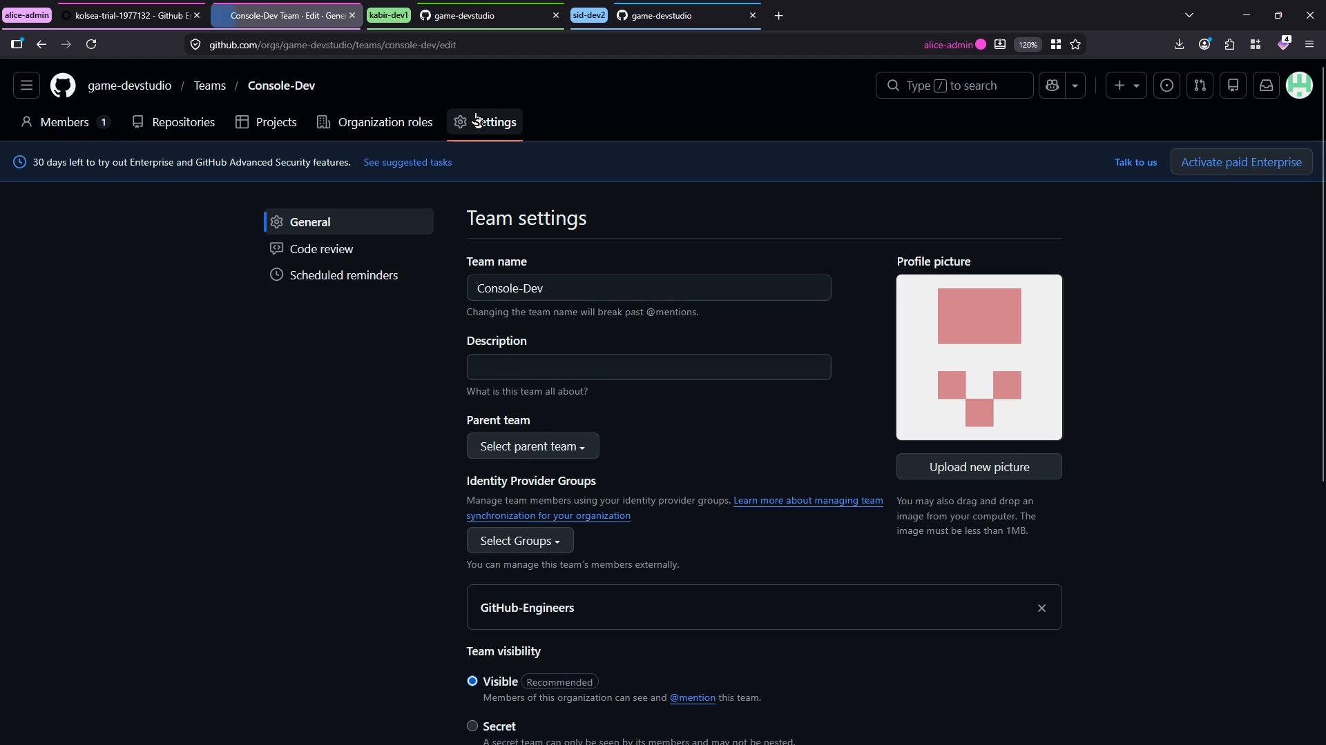A dark-themed GitHub "Team settings" page for the Console-Dev team, showing fields for team name, description, parent team, identity provider groups, visibility options, and a profile picture with an "Upload new picture" button. Browser tabs and other UI elements are visible across the top.