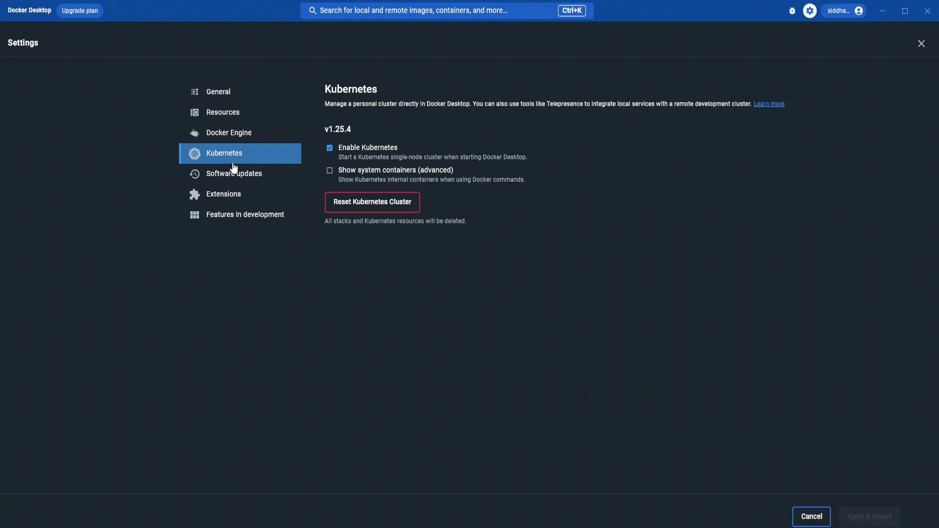 A screenshot of Docker Desktop's Settings on the Kubernetes tab, showing options like "Enable Kubernetes" and a highlighted "Reset Kubernetes Cluster" button. The left sidebar lists other settings such as General, Resources, Docker Engine, and Extensions.