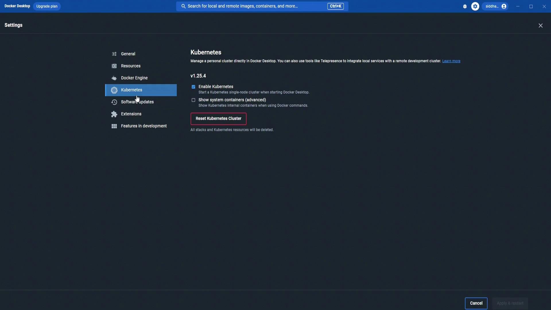 A screenshot of Docker Desktop's Settings on the Kubernetes tab, showing options like "Enable Kubernetes" and a highlighted "Reset Kubernetes Cluster" button. The left sidebar lists other settings such as General, Resources, Docker Engine, and Extensions.