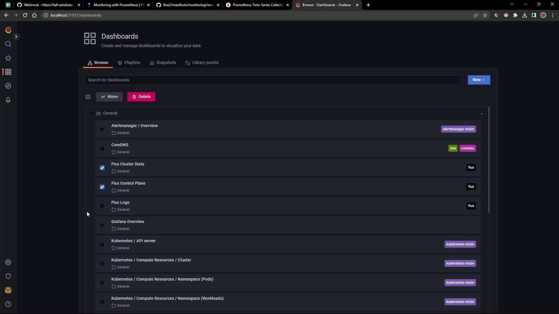 A screenshot of Grafana's "Dashboards" browse view in dark mode, showing a scrollable list of monitoring dashboards (Alertmanager, CoreDNS, Flux, Kubernetes, etc.) with checkboxes, tag labels, and action buttons (Move, Delete). The left navigation bar and browser tabs are also visible.