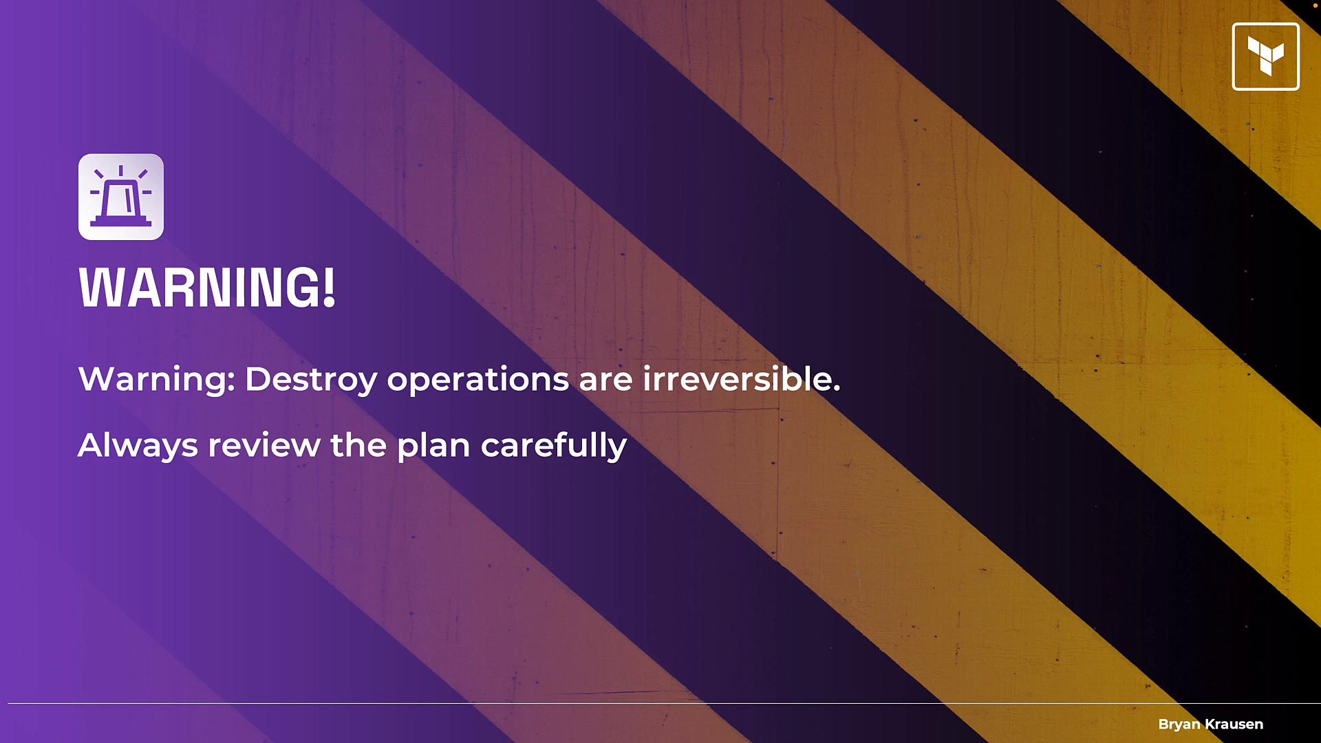 A purple warning slide showing an alarm icon and the message that destroy operations are irreversible and to always review the plan carefully. Diagonal black-and-yellow hazard stripes run across the right side.