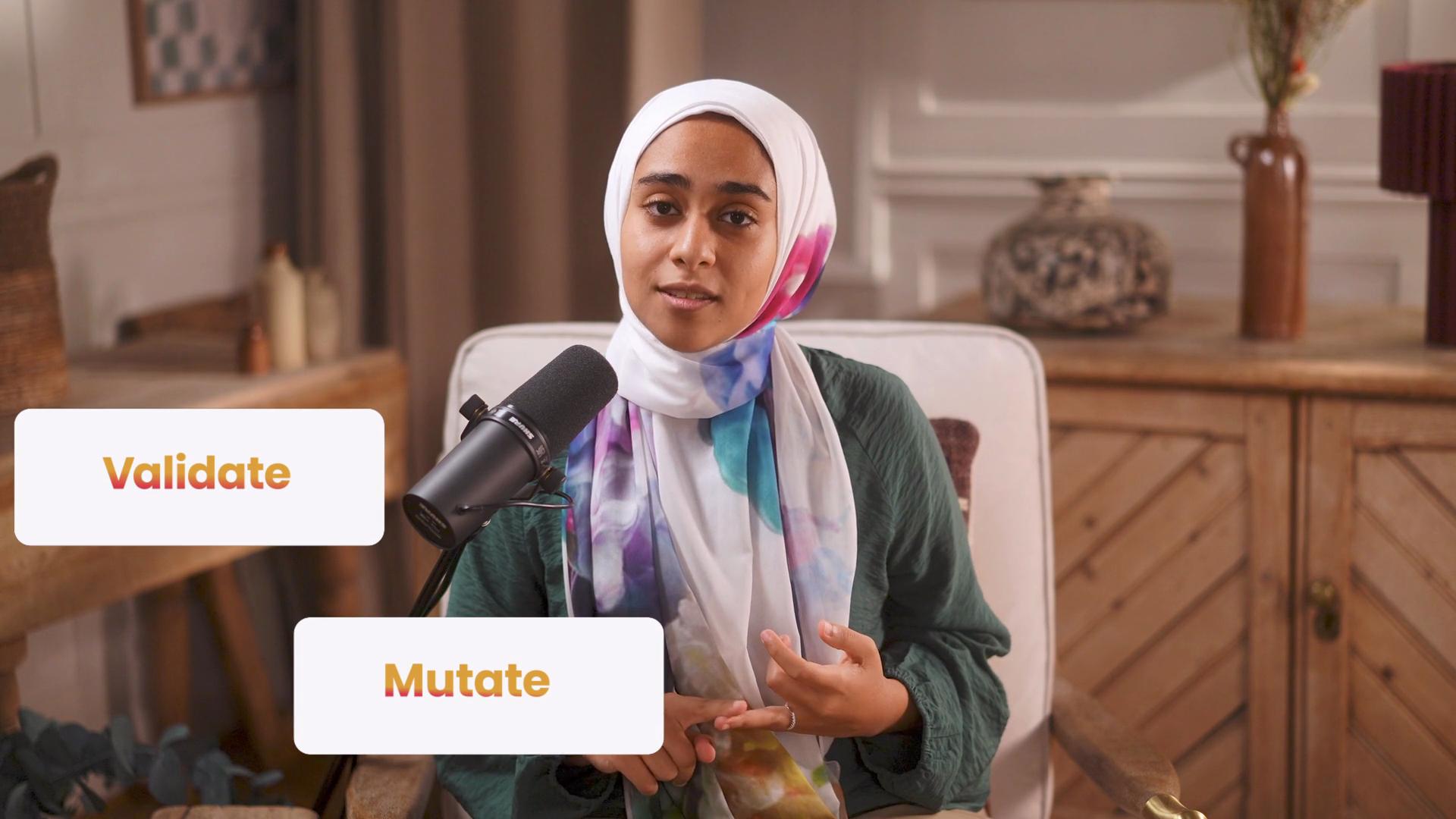 The image shows a person speaking into a microphone, sitting indoors, with the words "Validate" and "Mutate" displayed nearby.