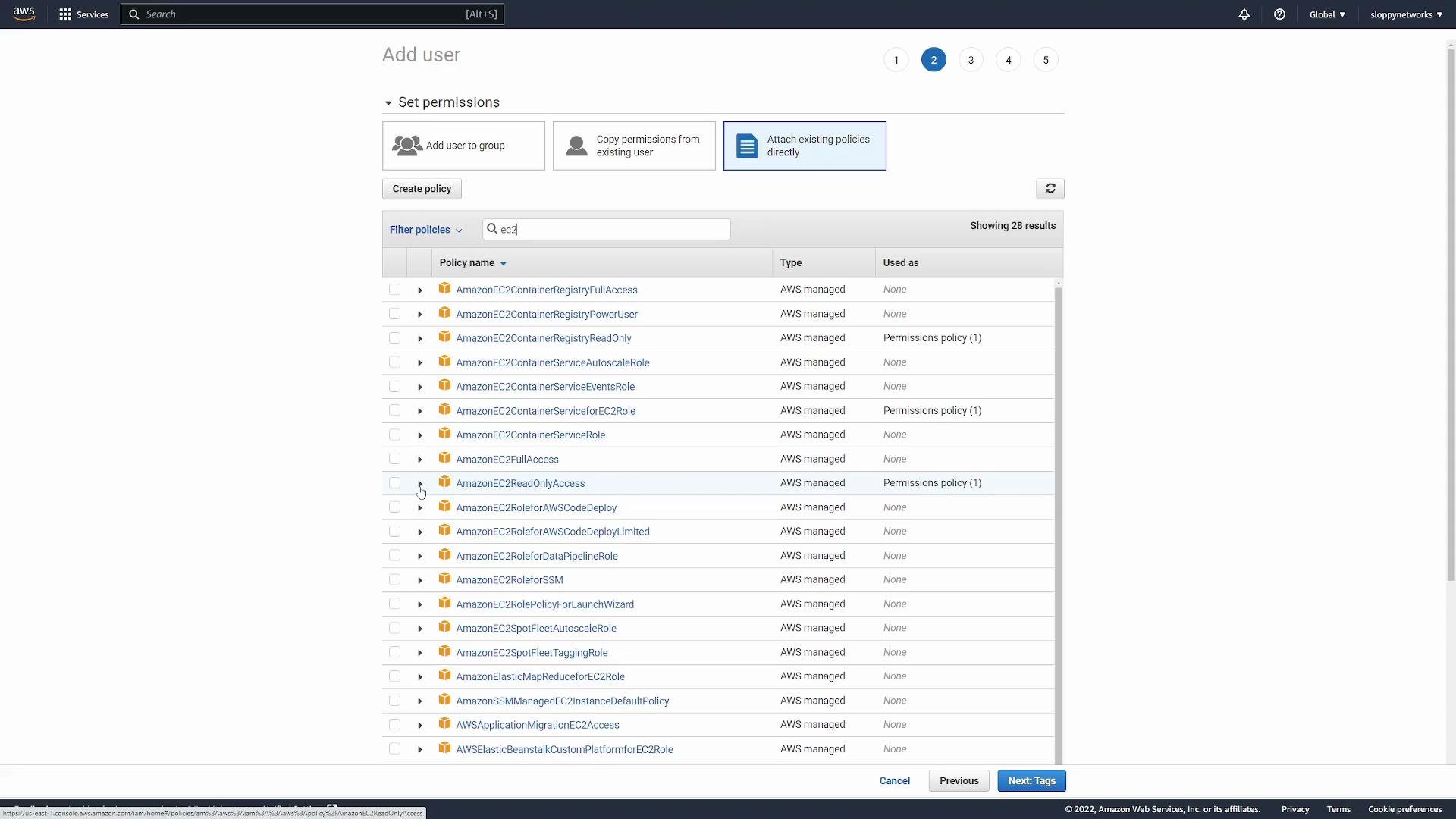 The image shows an AWS IAM console where a user is in the process of adding permissions by attaching existing policies. Several EC2-related AWS managed policies are listed for selection.