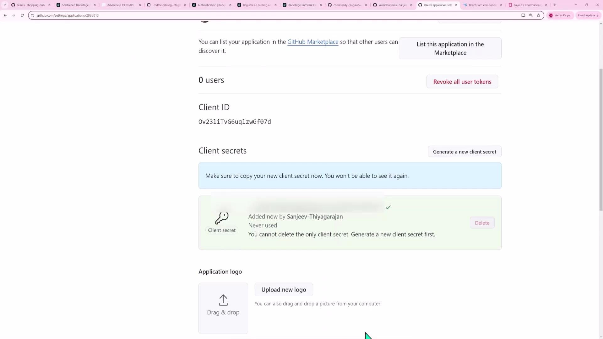 A screenshot of a GitHub OAuth application settings page showing the Client ID and Client secrets sections with buttons to generate or revoke secrets and a notice to copy the secret. The page also shows "0 users" and an area to upload an application logo.