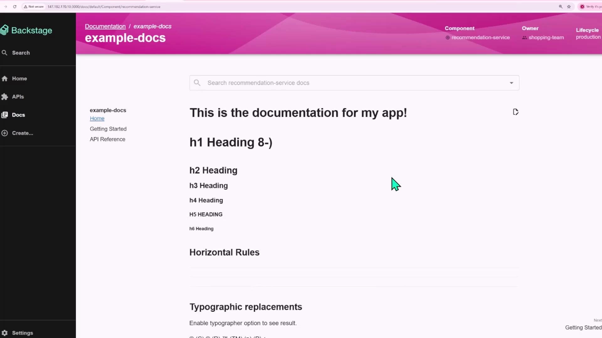 A screenshot of a Backstage documentation page titled "example-docs" showing a large heading "This is the documentation for my app!" with example h1–h6 headings. A dark left sidebar displays navigation items like Home, APIs, Docs, and Create.