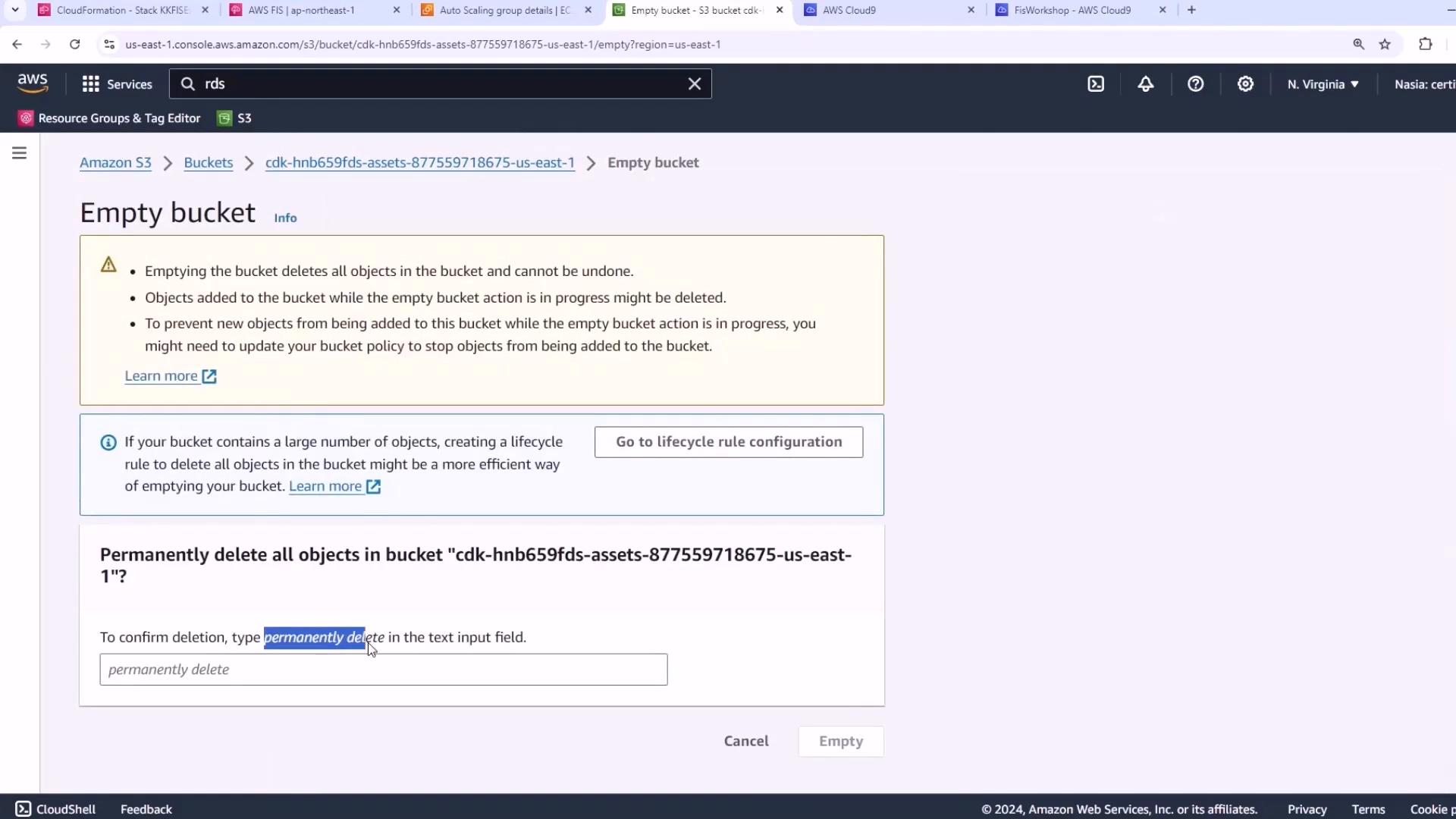A screenshot of the AWS S3 console showing an "Empty bucket" confirmation page with warnings about permanently deleting objects. It includes a text field requiring you to type "permanently delete" and buttons to Cancel or Empty the bucket.