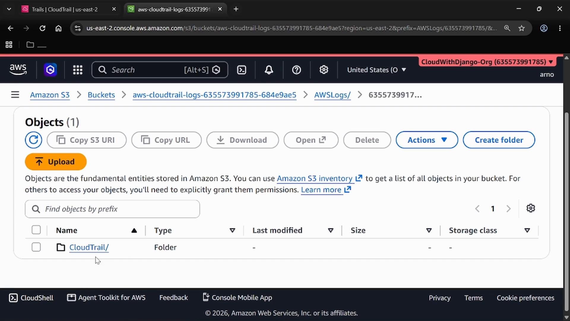 A screenshot of the Amazon S3 console showing the Objects view for an aws-cloudtrail-logs bucket, with a CloudTrail/ folder listed. The toolbar shows buttons like Upload, Copy S3 URI, Download, Actions, and Create folder.