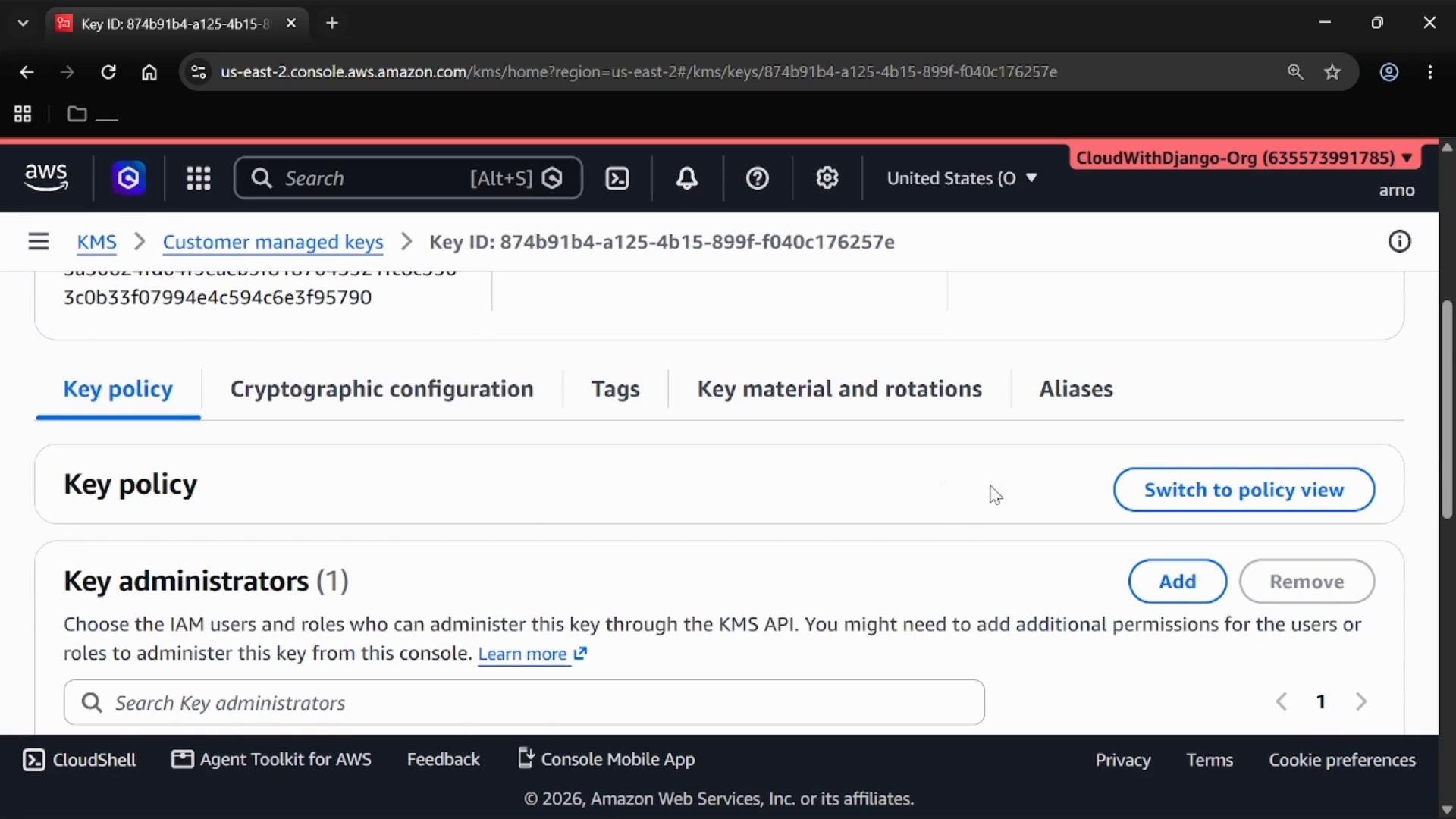 A screenshot of the AWS KMS console showing a customer-managed key details page. The "Key policy" tab is selected, showing the Key policy and Key administrators sections with action buttons like "Switch to policy view", "Add", and "Remove."