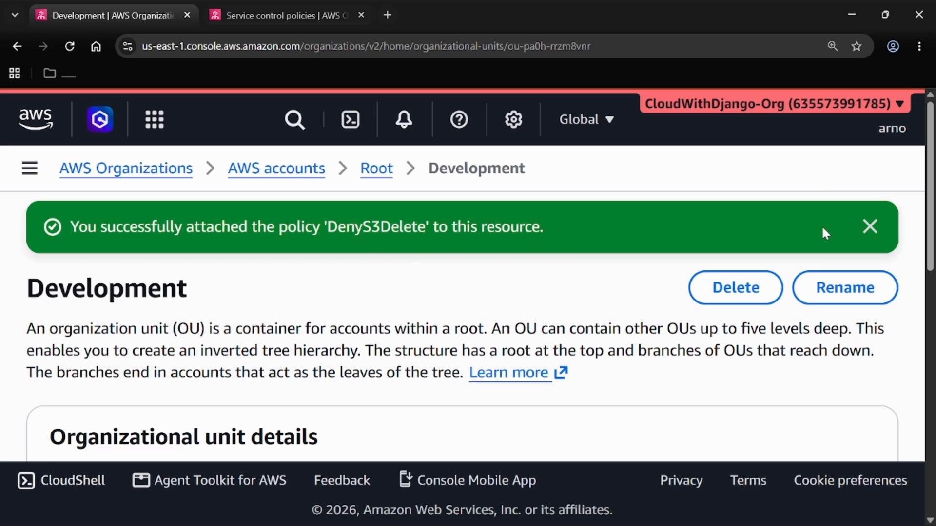 A screenshot of the AWS Organizations console showing the "Development" organizational unit page with a green success banner that reads "You successfully attached the policy 'DenyS3Delete' to this resource." The page also shows action buttons like Delete and Rename and organizational unit details text.