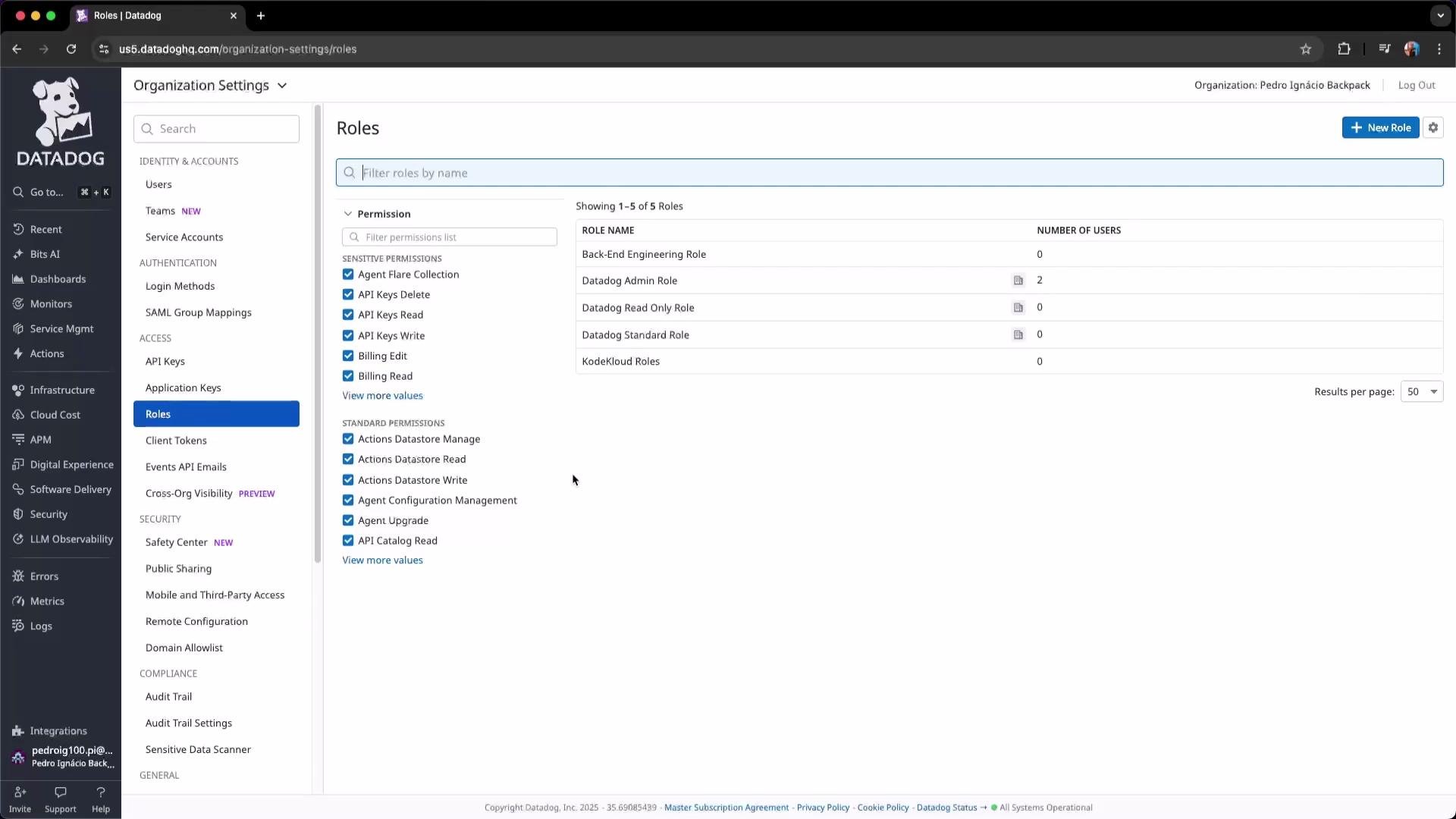 This image shows the roles management section of Datadog's organization settings, displaying various roles and associated user numbers.