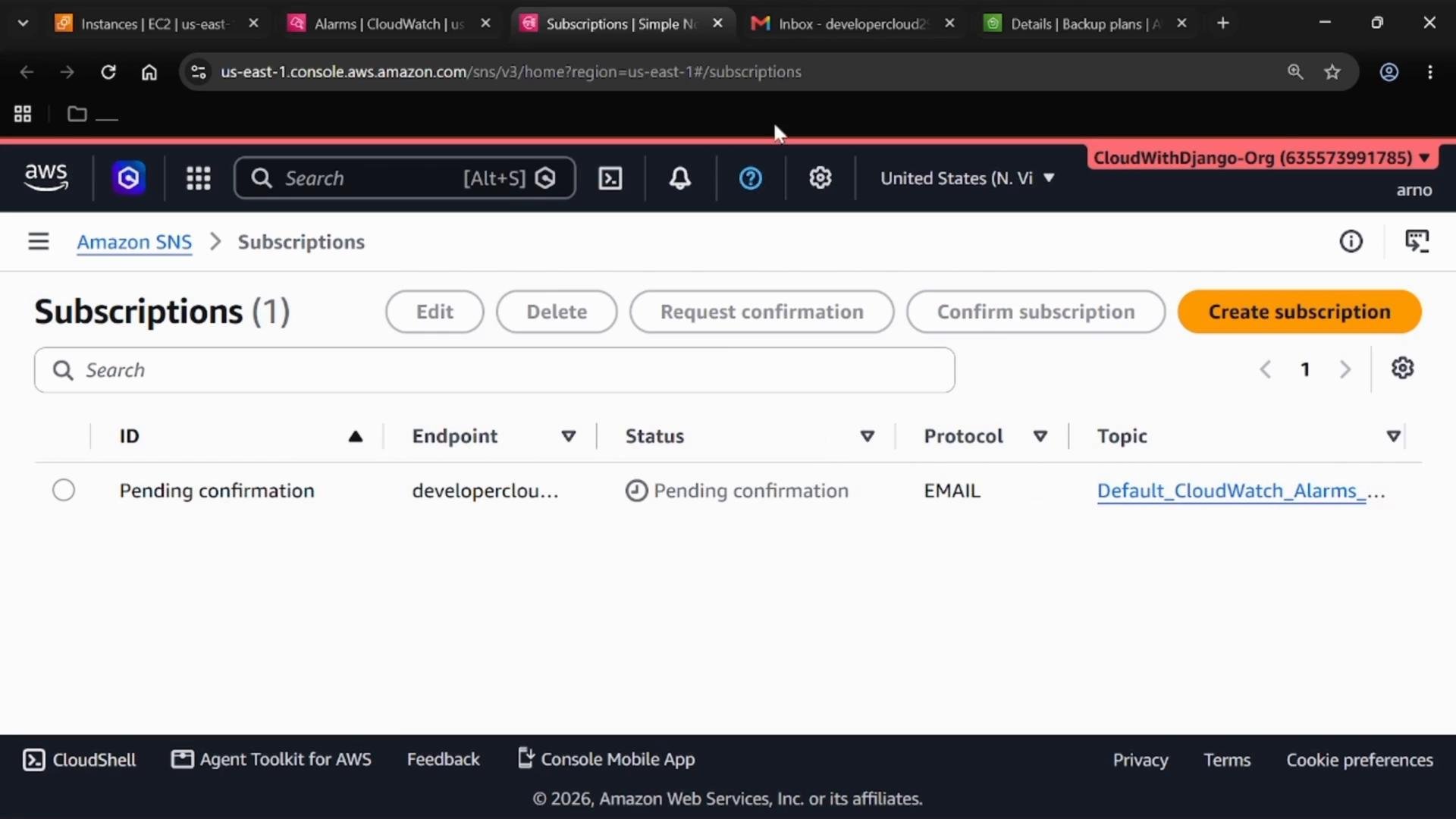 A screenshot of the AWS Management Console showing the Amazon SNS "Subscriptions" page, with one email subscription listed as "Pending confirmation" for a CloudWatch alarms topic. The page includes buttons like Create subscription, Confirm subscription, Edit, and Delete.