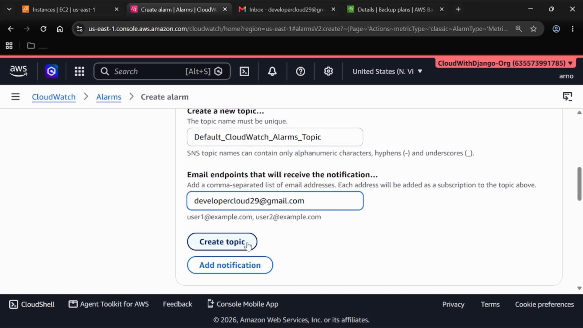 A screenshot of the AWS CloudWatch "Create alarm" page. It shows creating an SNS topic named "Default_CloudWatch_Alarms_Topic" with the email endpoint developercloud29@gmail.com and buttons labeled "Create topic" and "Add notification."