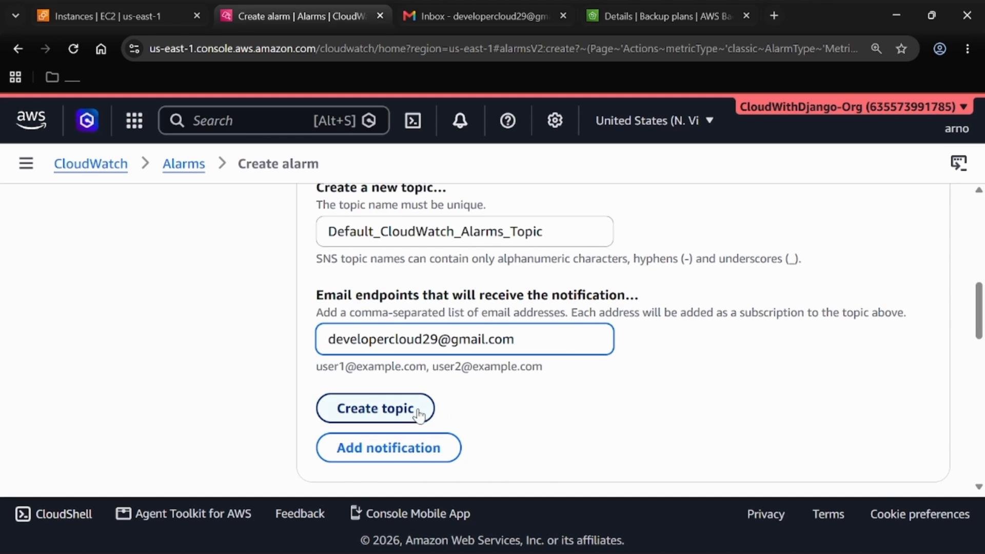 A screenshot of the AWS CloudWatch "Create alarm" page. It shows creating an SNS topic named "Default_CloudWatch_Alarms_Topic" with the email endpoint developercloud29@gmail.com and buttons labeled "Create topic" and "Add notification."