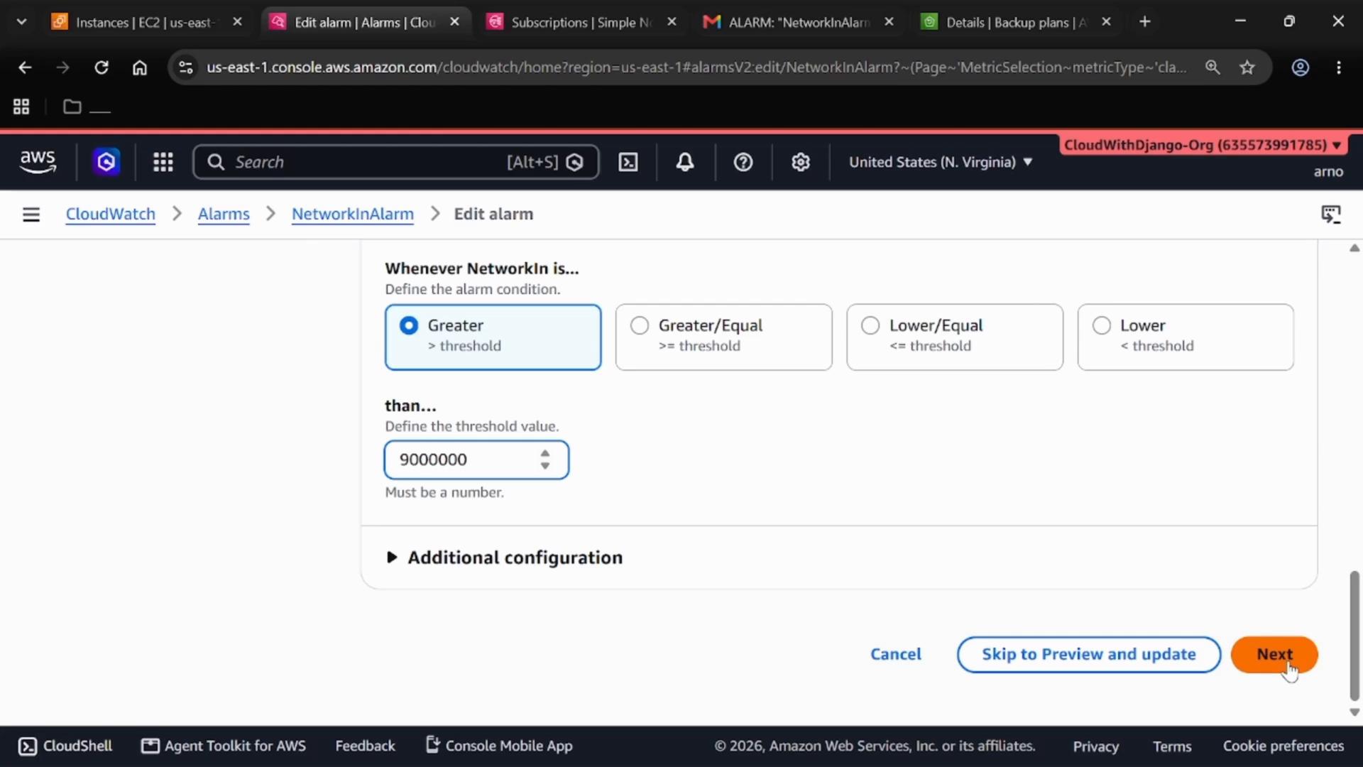A screenshot of the AWS CloudWatch "Edit alarm" page showing alarm condition options with "Greater" selected and the threshold set to 9,000,000, and a "Next" button visible. The breadcrumb shows CloudWatch > Alarms > NetworkInAlarm.