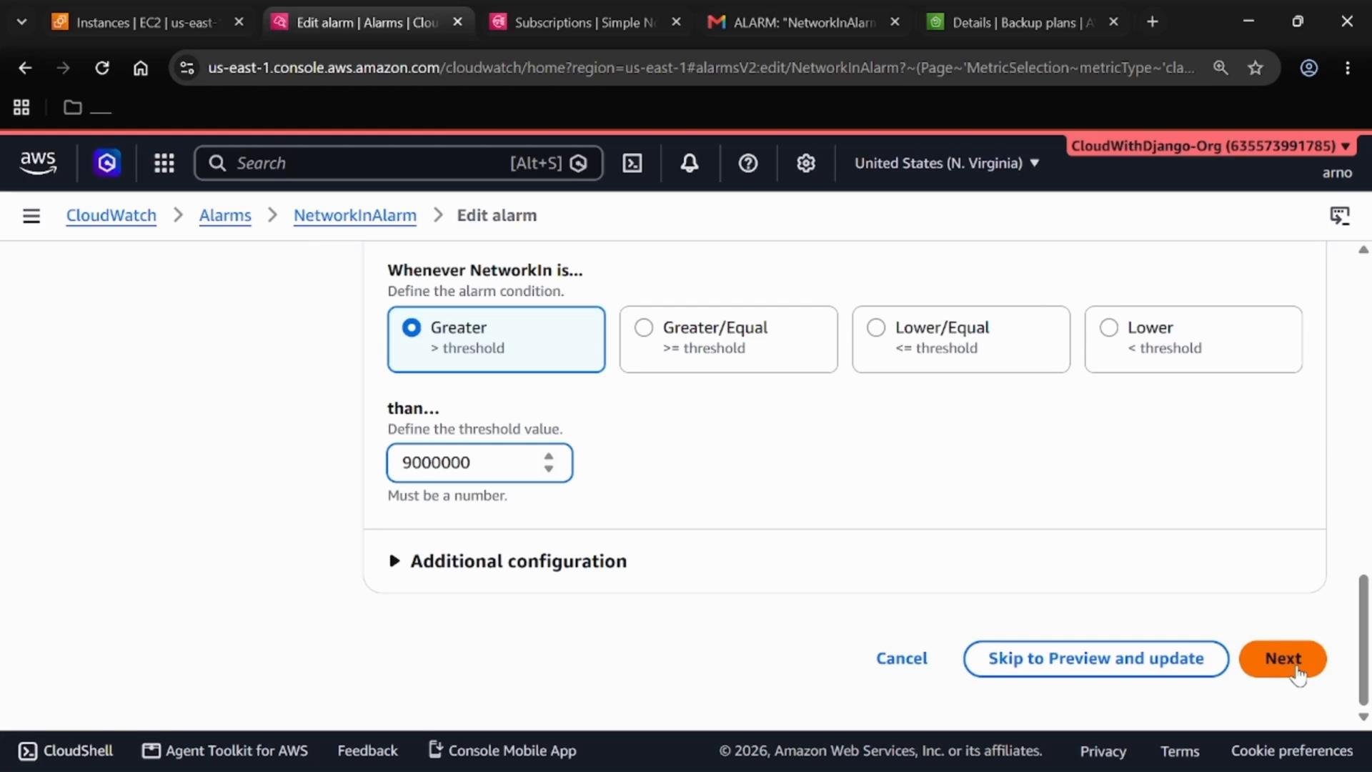 A screenshot of the AWS CloudWatch "Edit alarm" page showing alarm condition options with "Greater" selected and the threshold set to 9,000,000, and a "Next" button visible. The breadcrumb shows CloudWatch > Alarms > NetworkInAlarm.