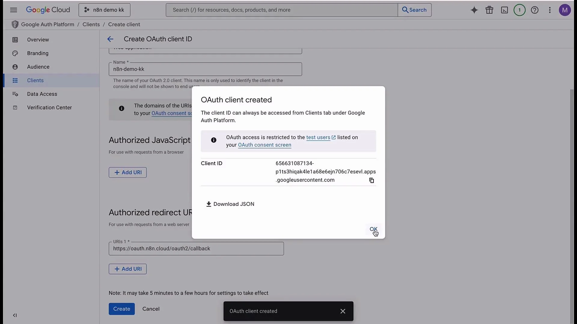 The image shows a Google Cloud interface where an OAuth client ID has been successfully created, along with options to download the associated JSON file.