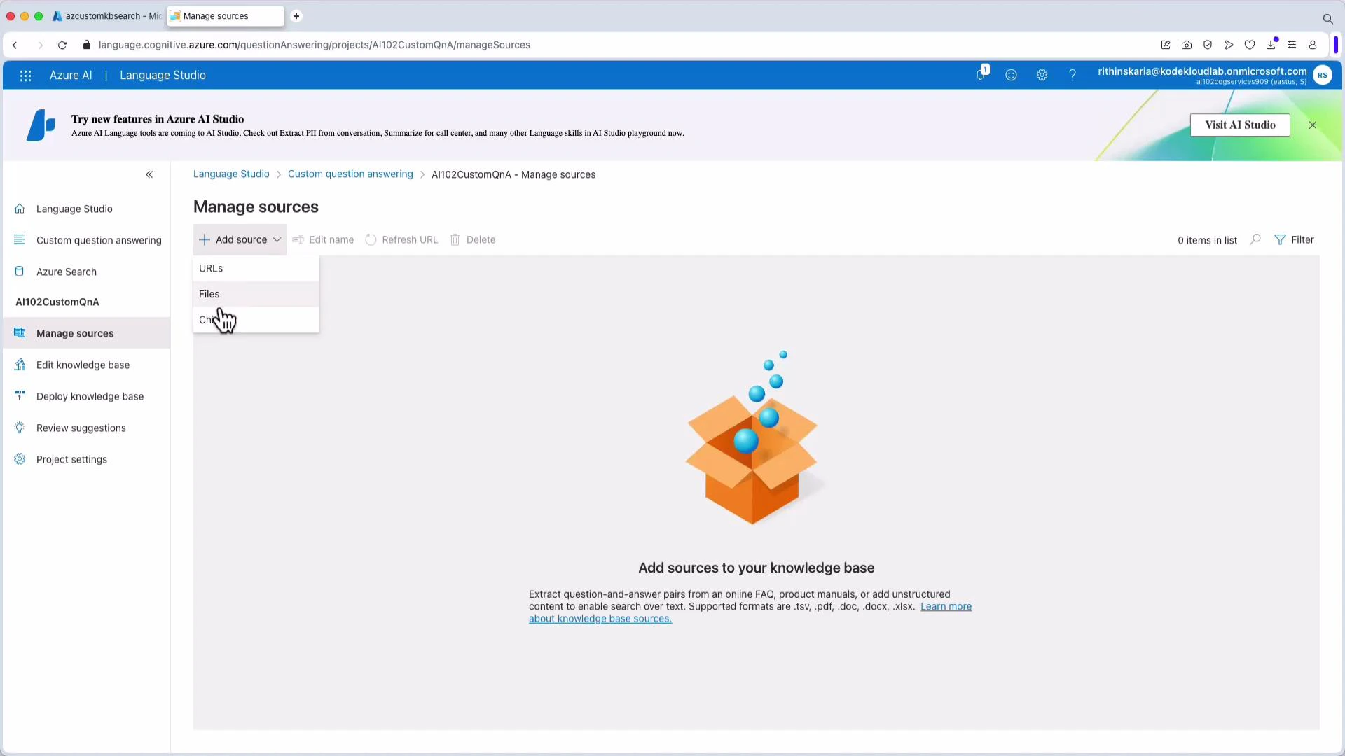 A screenshot of the Azure AI Language Studio "Manage sources" page showing an empty knowledge base area with an "Add source" dropdown (URLs, Files) and a cartoon box illustration. The left sidebar shows navigation options like Custom question answering, Manage sources, Edit knowledge base, and Project settings.