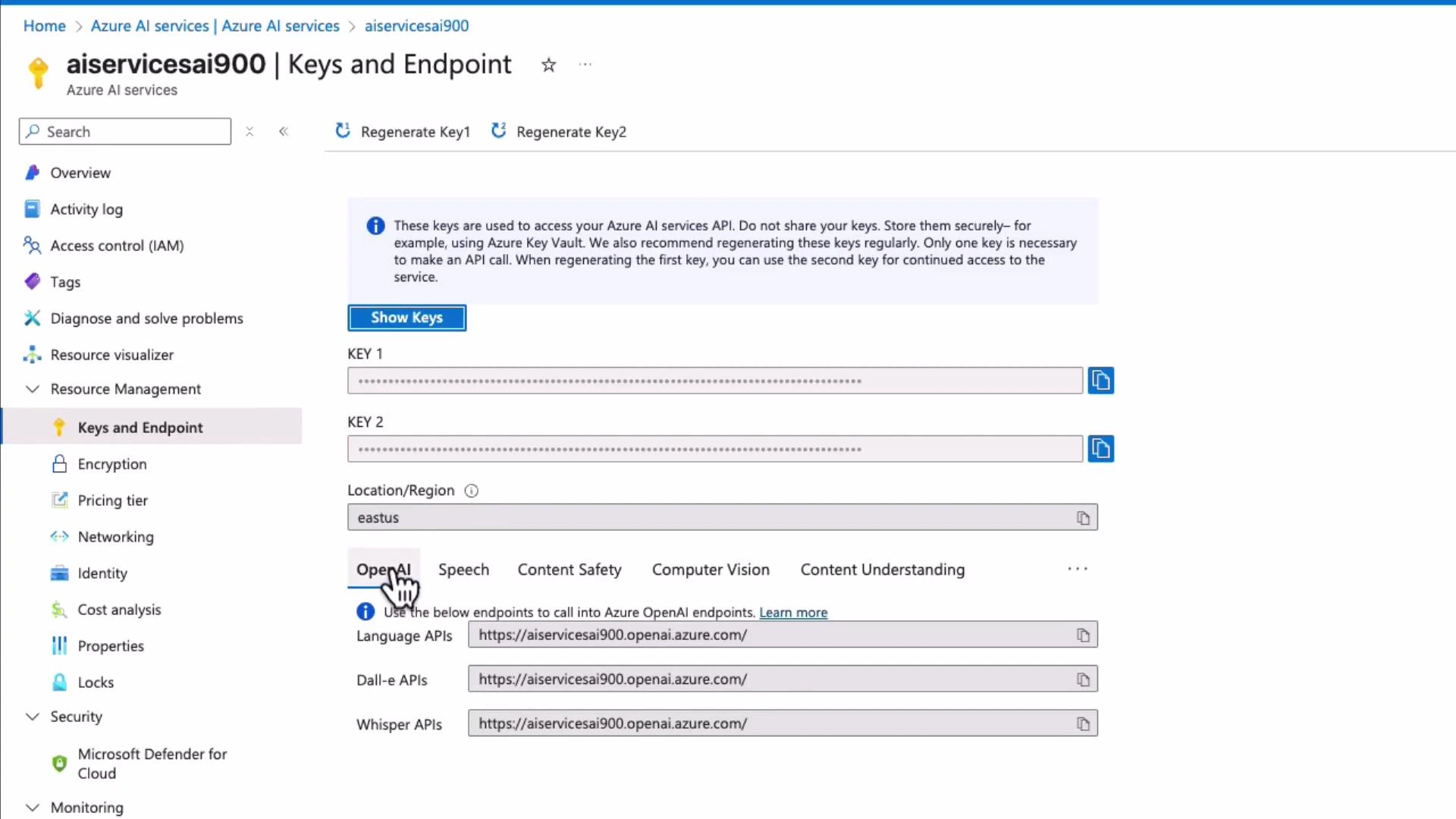 A screenshot of the Azure AI Services "Keys and Endpoint" page for the resource "aiservicesai900." It shows masked API keys, the location "eastus," and OpenAI endpoints for Language, Dall‑E, and Whisper.