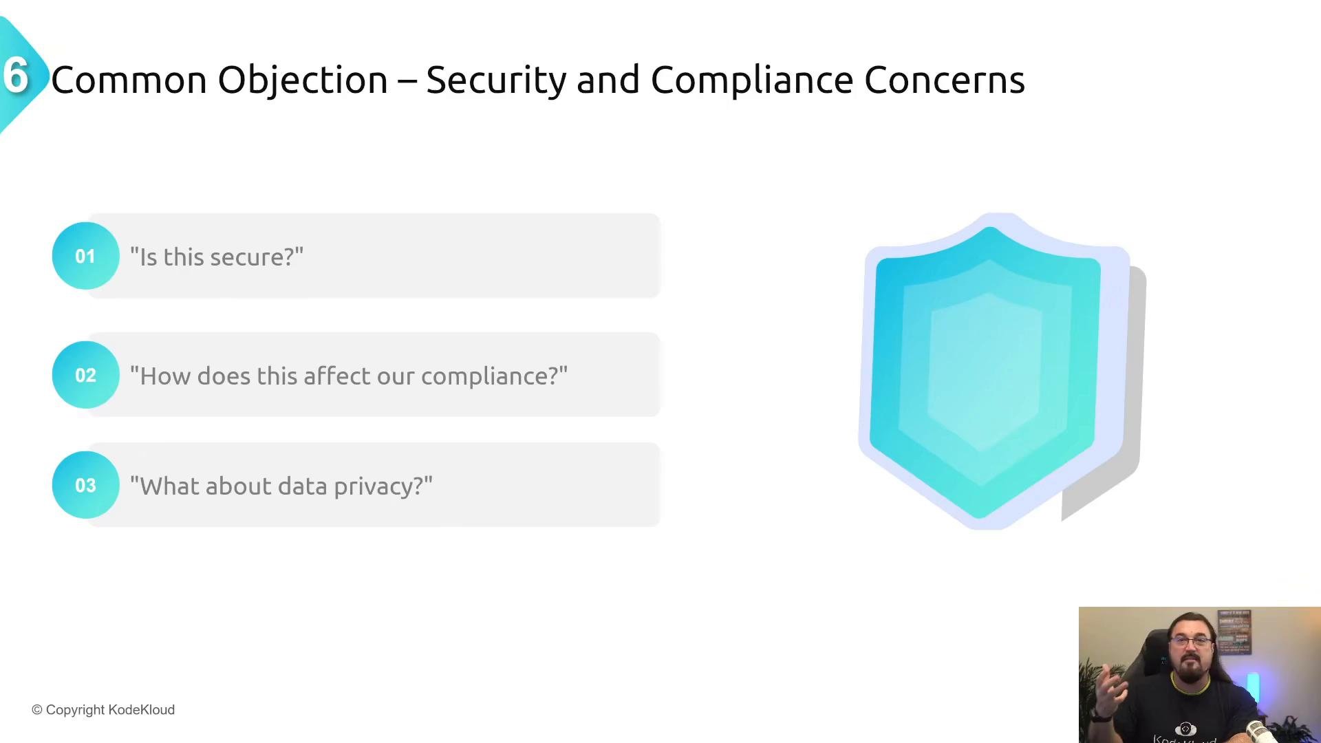 A presentation slide titled "Common Objection – Security and Compliance Concerns" listing three questions: "Is this secure?", "How does this affect our compliance?", and "What about data privacy?" The slide also shows a large shield graphic and a small presenter video thumbnail in the corner.